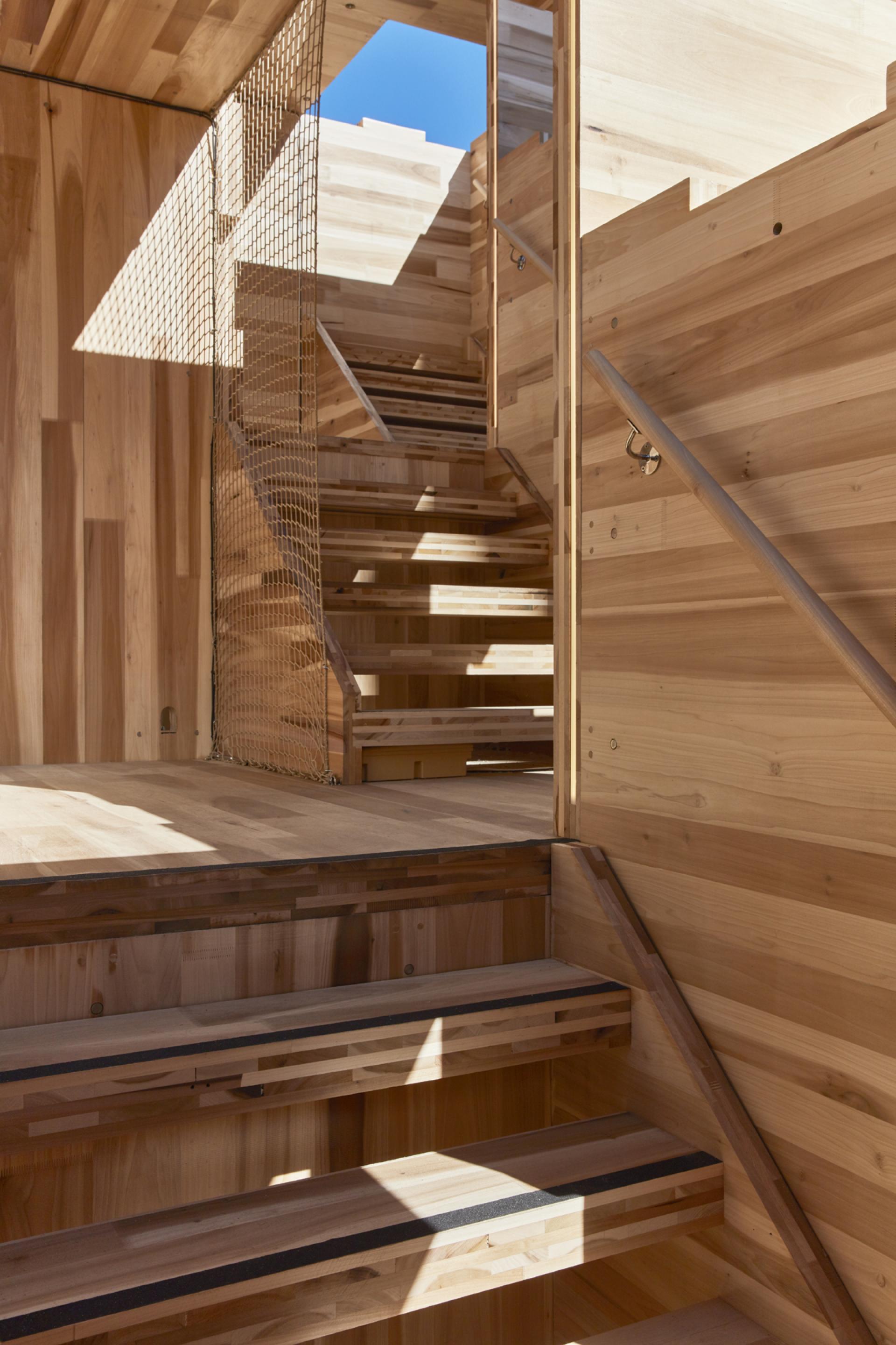 Interior view of MultiPly's wooden staircase, showcasing eco-friendly American tulipwood construction and design.