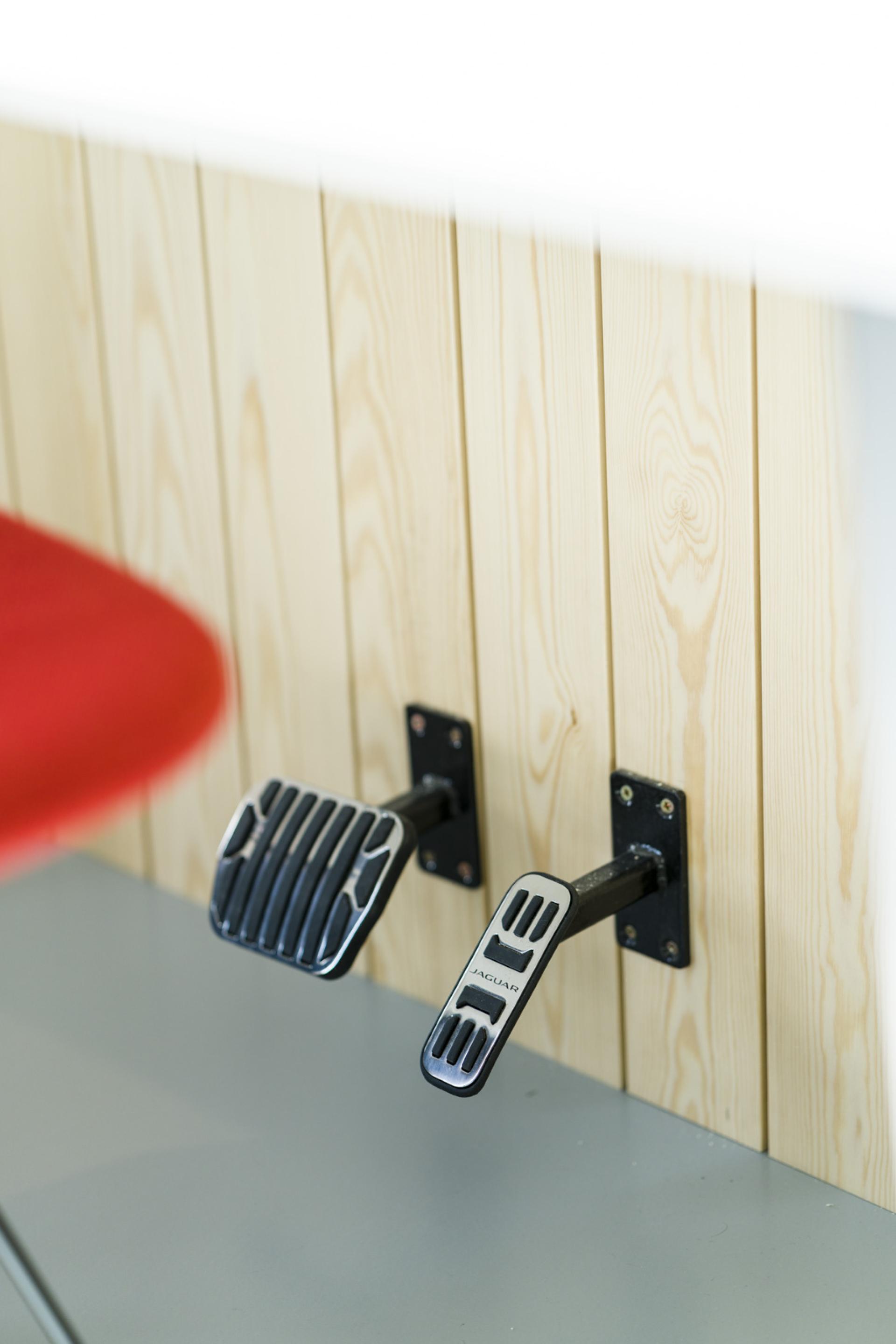 Stylish pedal design mounted on a light wood wall, highlighting playful and innovative interior architecture by align.