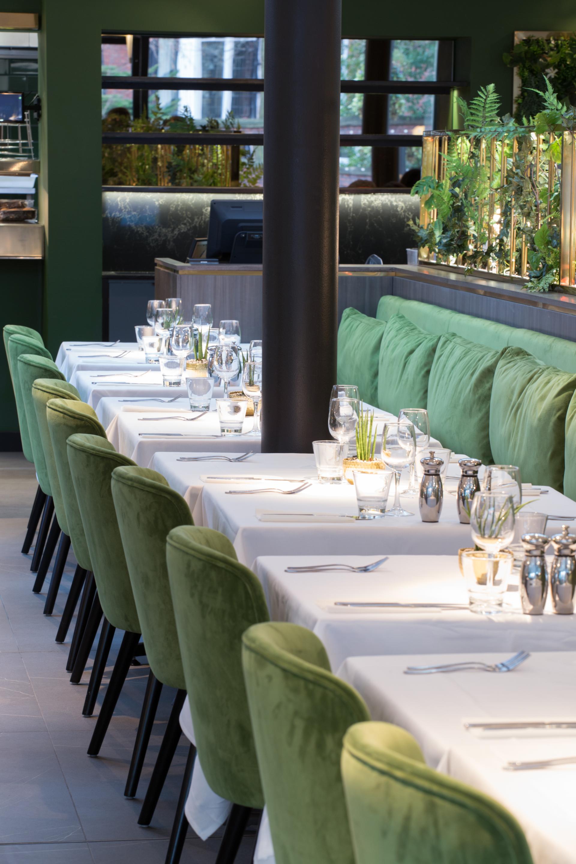 Refurbished dining area at Albert's Didsbury, featuring elegant green seating and table settings for a hospitality award nomination.