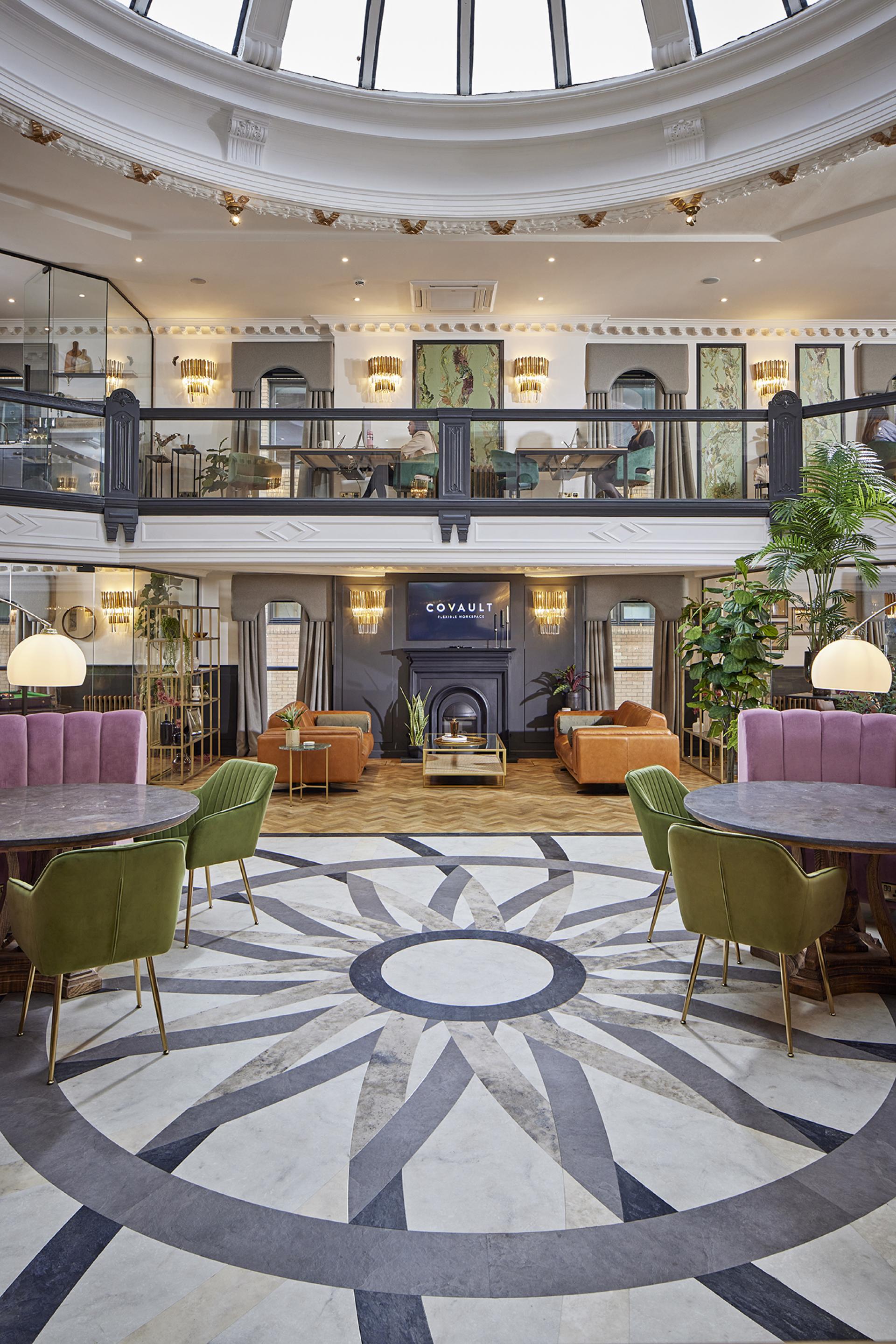 Stylish interior of CoVault in Glasgow featuring elegant Karndean Designflooring with intricate patterns and cozy seating arrangements.