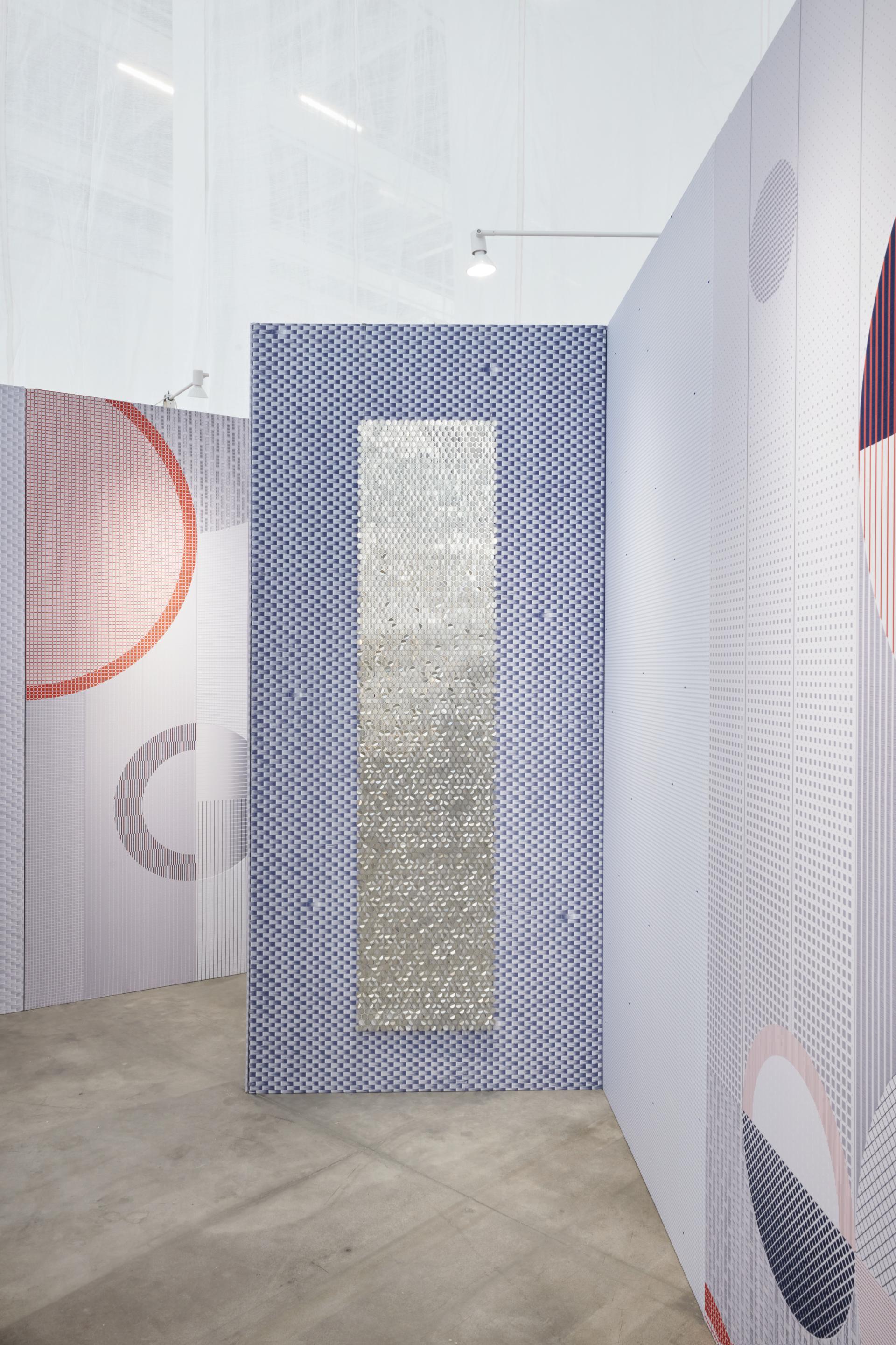 Colorful, patterned walls create a serene space emphasizing wellness at Dutch Design Week, showcasing Alissa & Nienke’s innovative design.