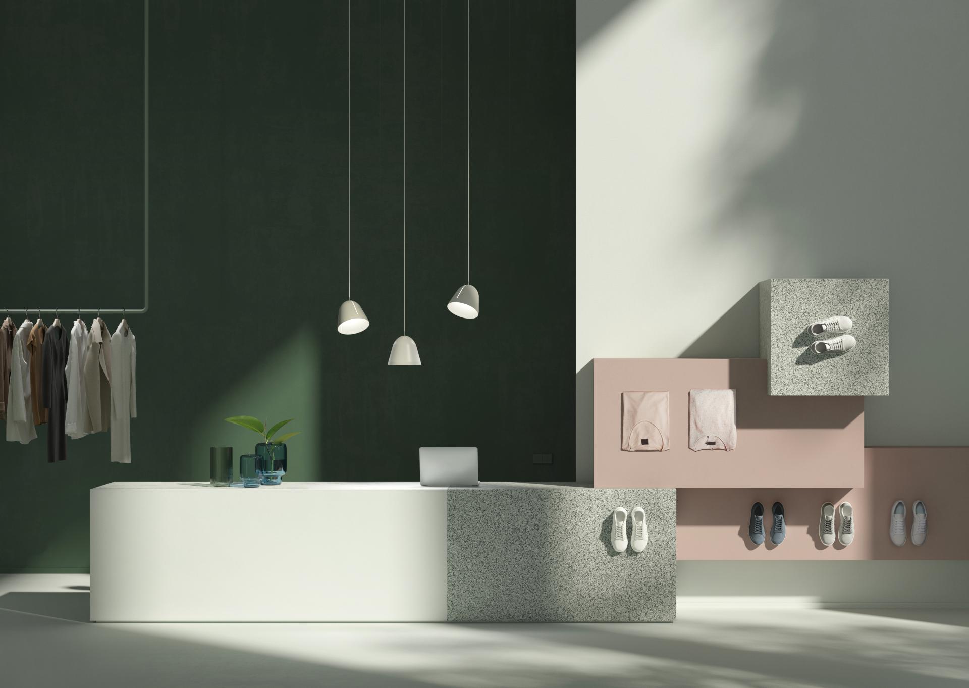 Stylish retail space featuring minimalist design elements, clothing displays, and modern accessories in a bright setting.