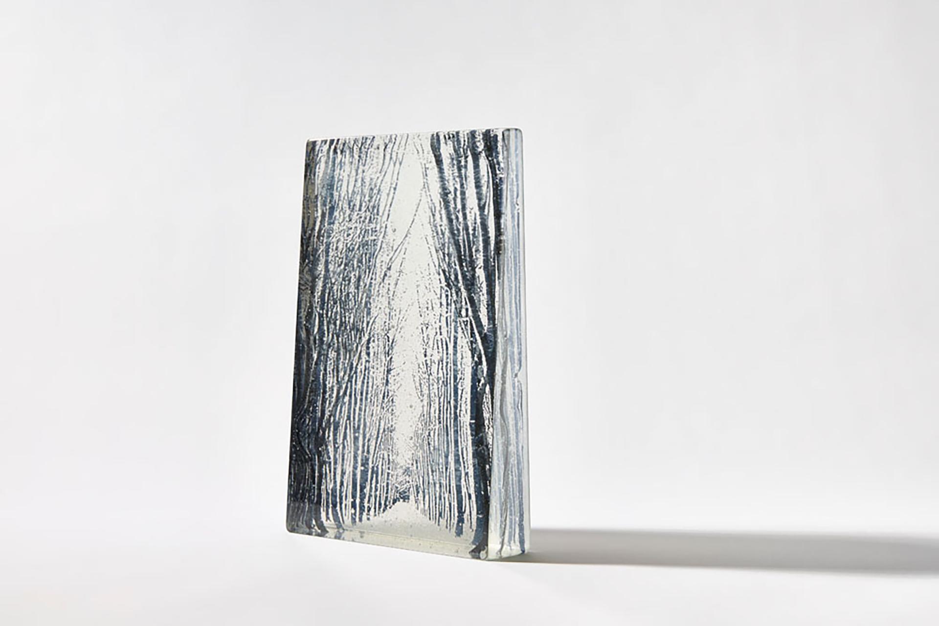 Artistic glass piece depicting a forest scene, showcasing the craftsmanship central to Design Nation’s designer-makers.