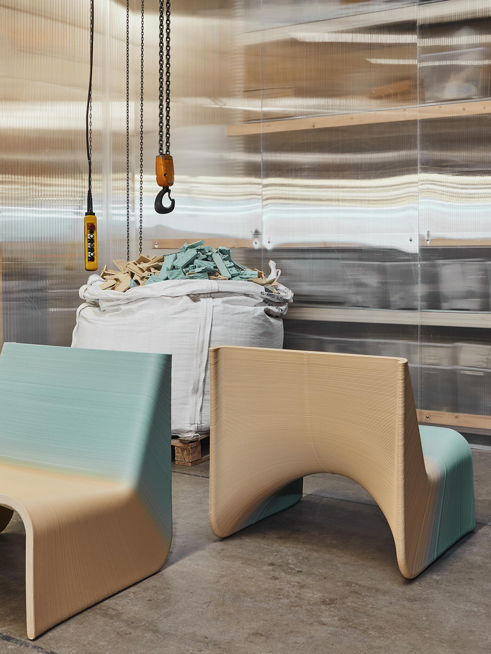 Innovative Ermis chairs in soft colors, showcasing The New Raw's zero waste design approach in a studio setting.