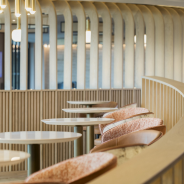 Stylish lounge area with modern furniture and wooden accents, highlighting design elements in aviation project development.