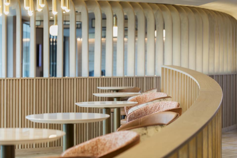 Stylish lounge area with modern furniture and wooden accents, highlighting design elements in aviation project development.