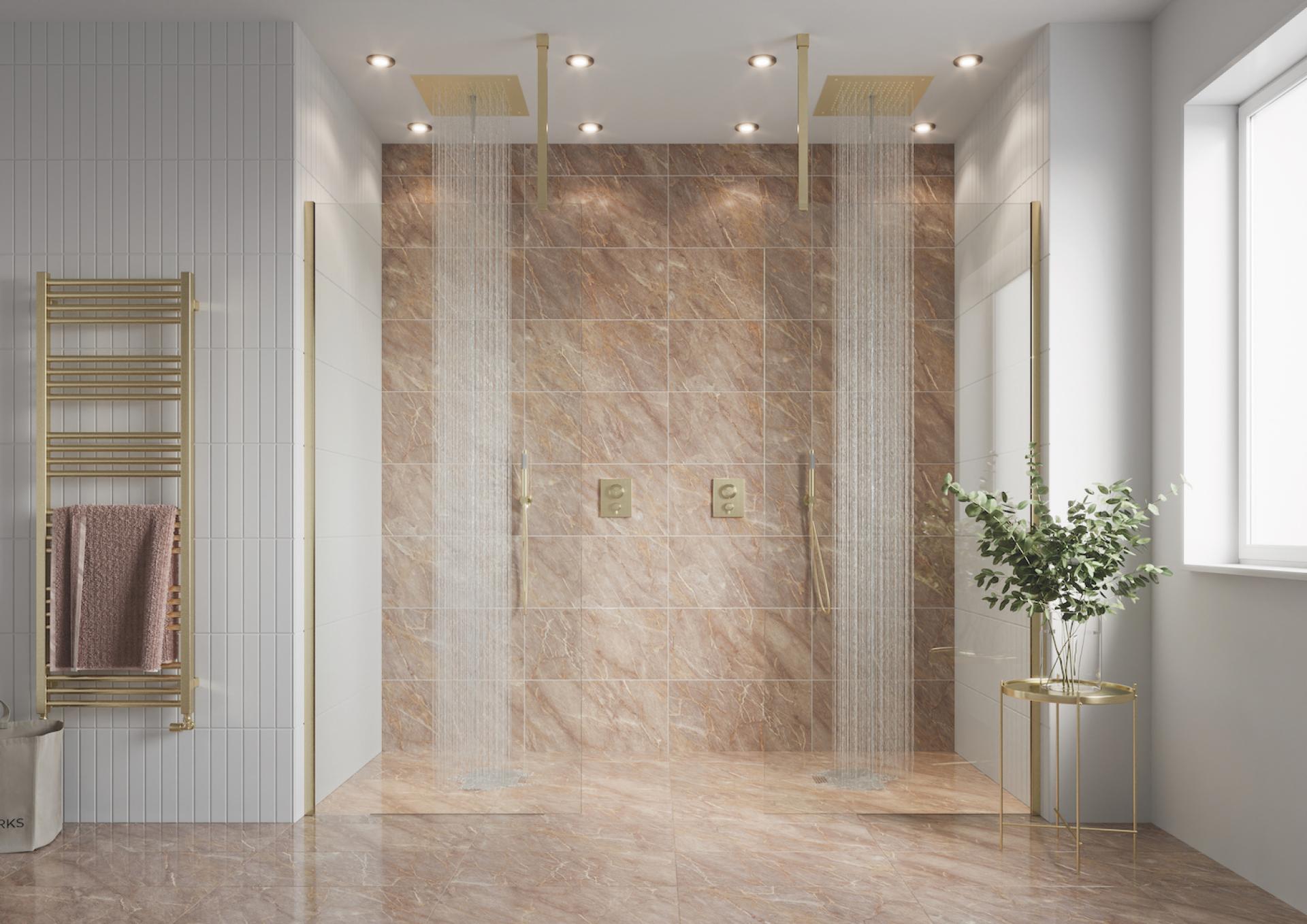 Luxurious modern bathroom featuring a double shower, elegant marble tiles, and stylish gold fixtures, reflecting 2022 bathroom trends.