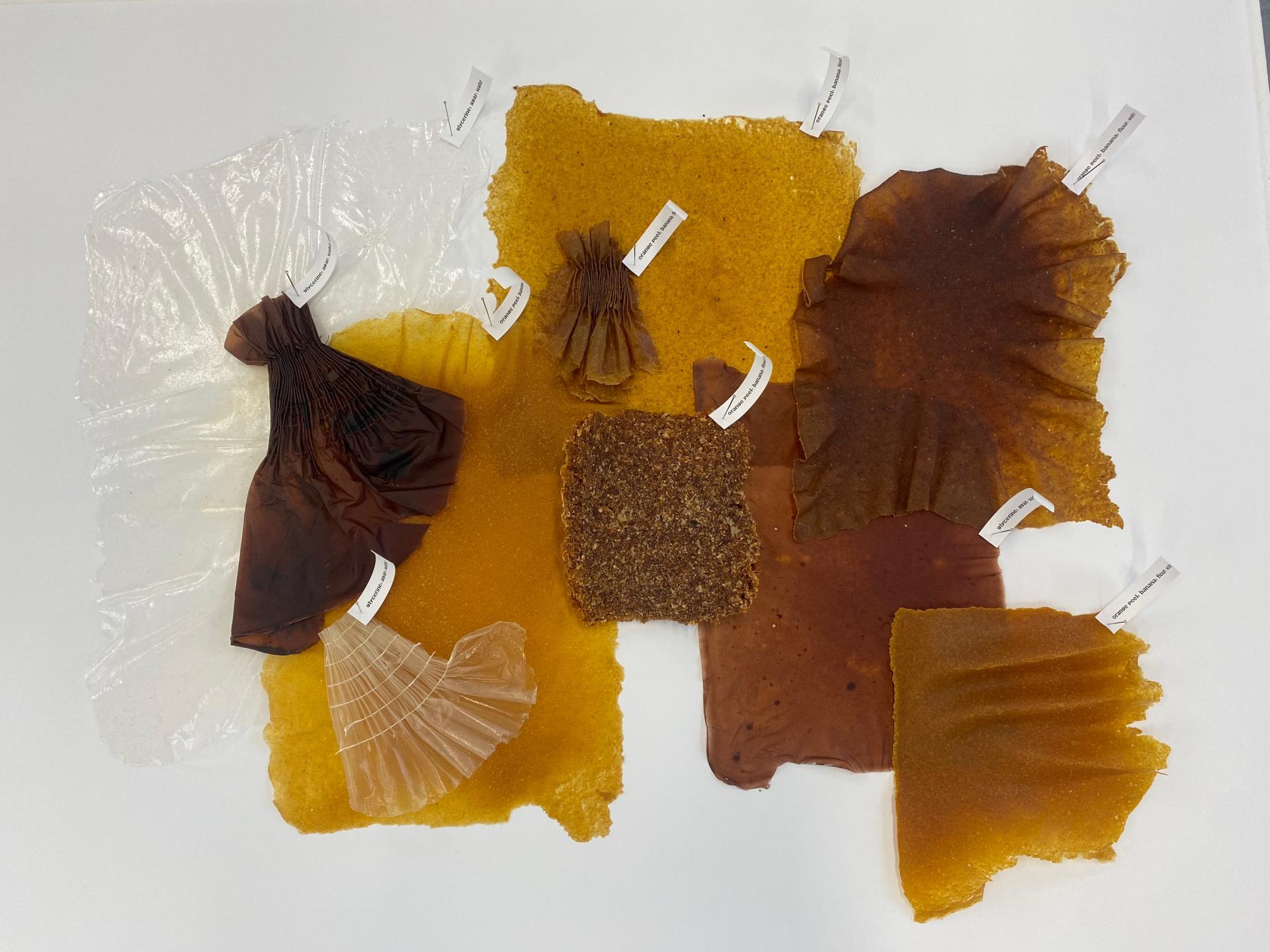 Innovative biodegradable material samples displayed at New Designers 2024, showcasing diverse textures and colors for sustainable design.