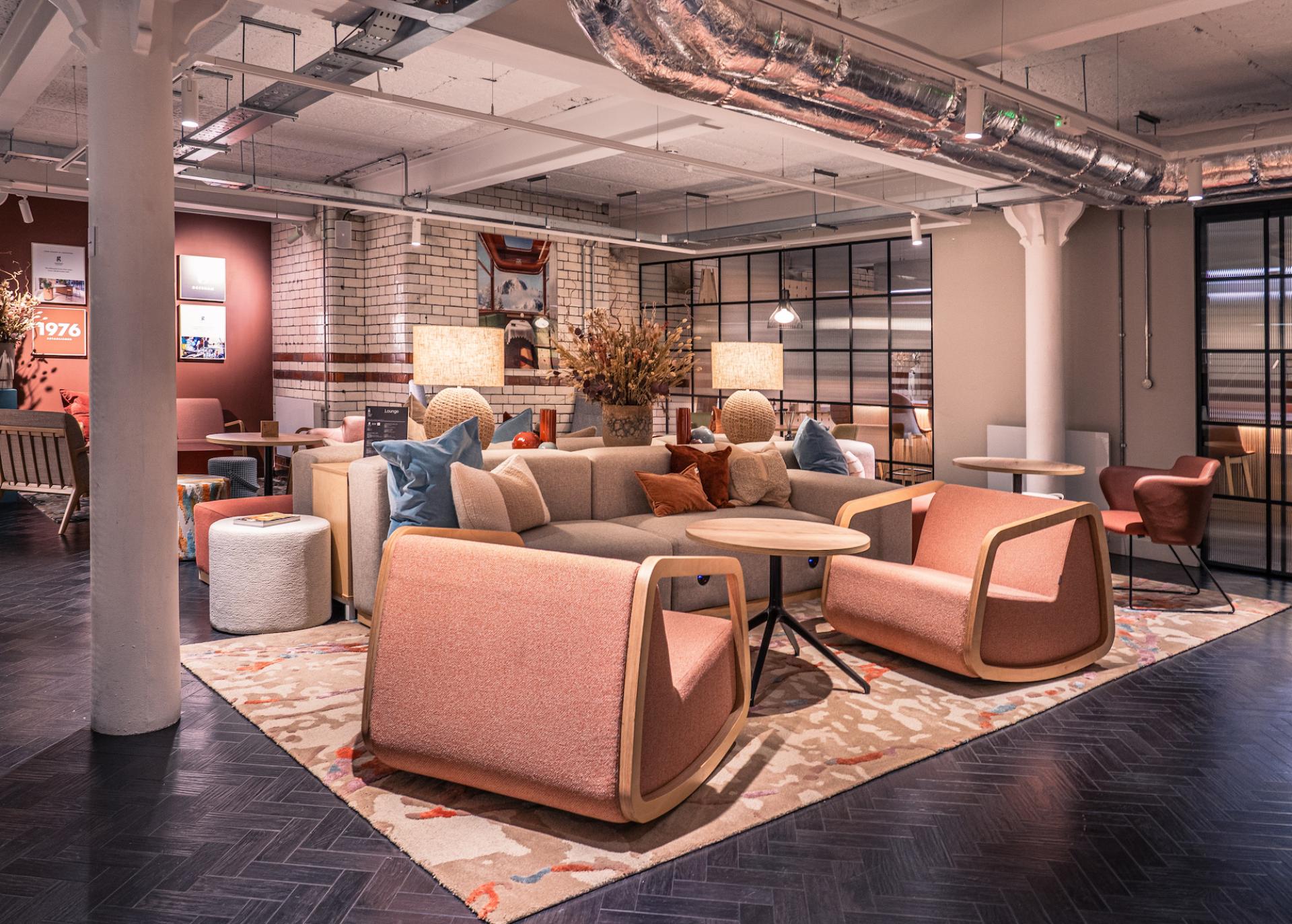 Bespoke rugs by Newhey showcased in a contemporary lounge with earthy tones and stylish furniture elements.