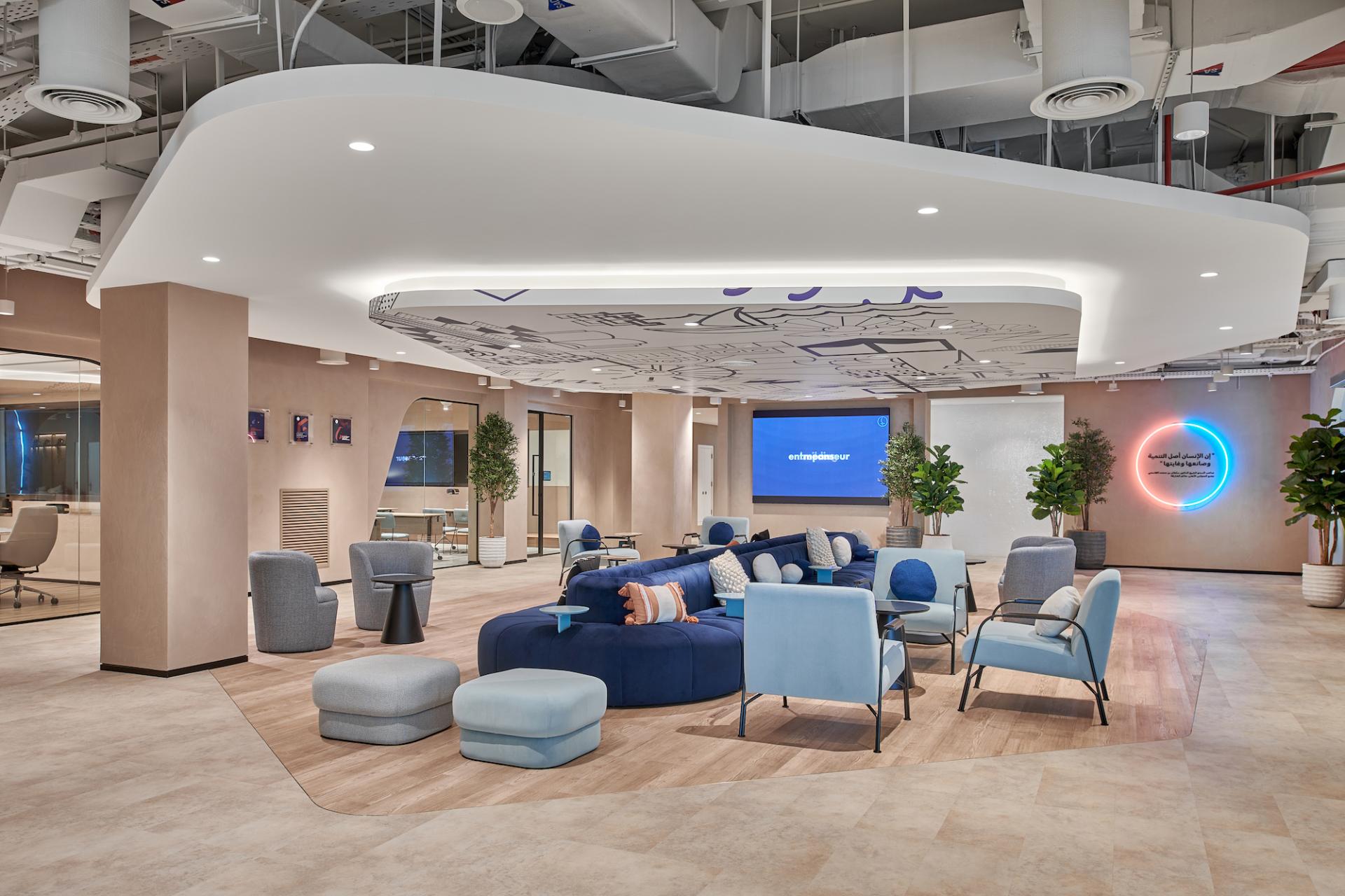 Modern entrepreneurship center interior featuring vibrant seating areas, innovative design elements, and collaborative spaces for startups.