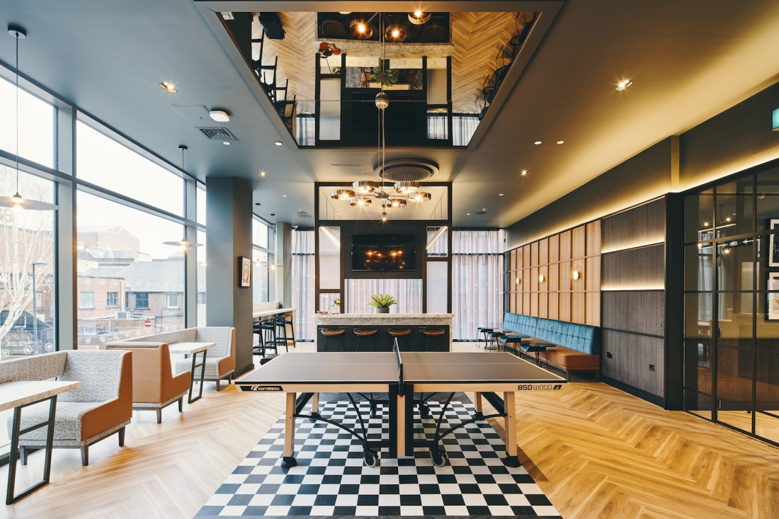 Symons House, Leeds - The central screen reaches from the dry bar to the ceiling. Photography by Gu Shi Yin