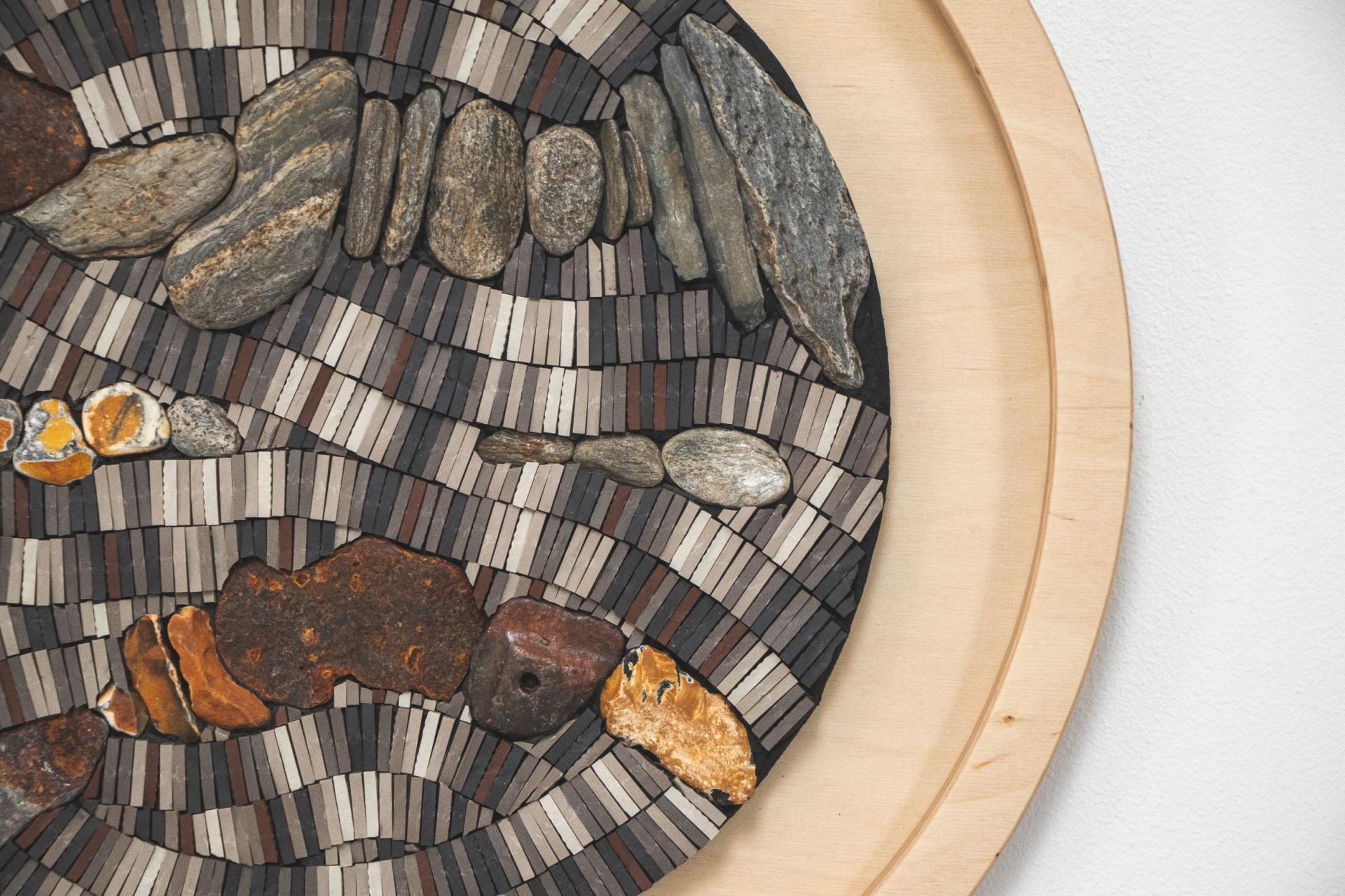 Intricate mosaic artwork featuring various stones and materials, showcasing creative craft from Nottingham's vibrant art scene.