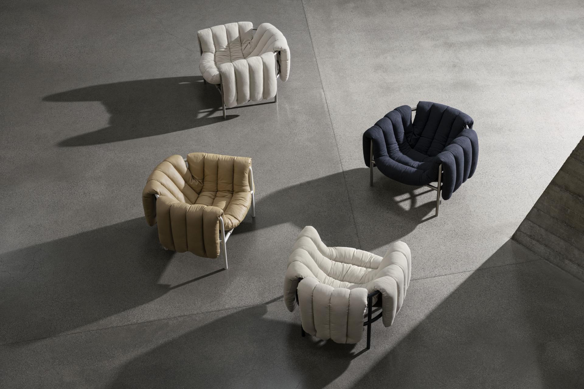 Puffy Lounge Chairs in various colors showcased on a textured floor, highlighting their innovative design by Toogood for Hem.