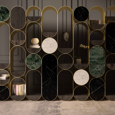 Elegant minimalist bookshelf design by Nabil Issa featuring contrasting black, green, and white marble with gold accents.