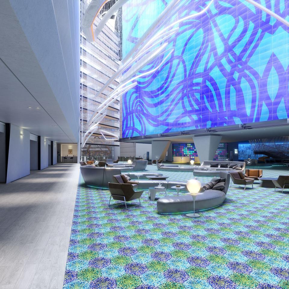 Vibrant lounge area featuring Mac Stopa's artistic flooring design, showcasing colorful patterns and modern furniture.