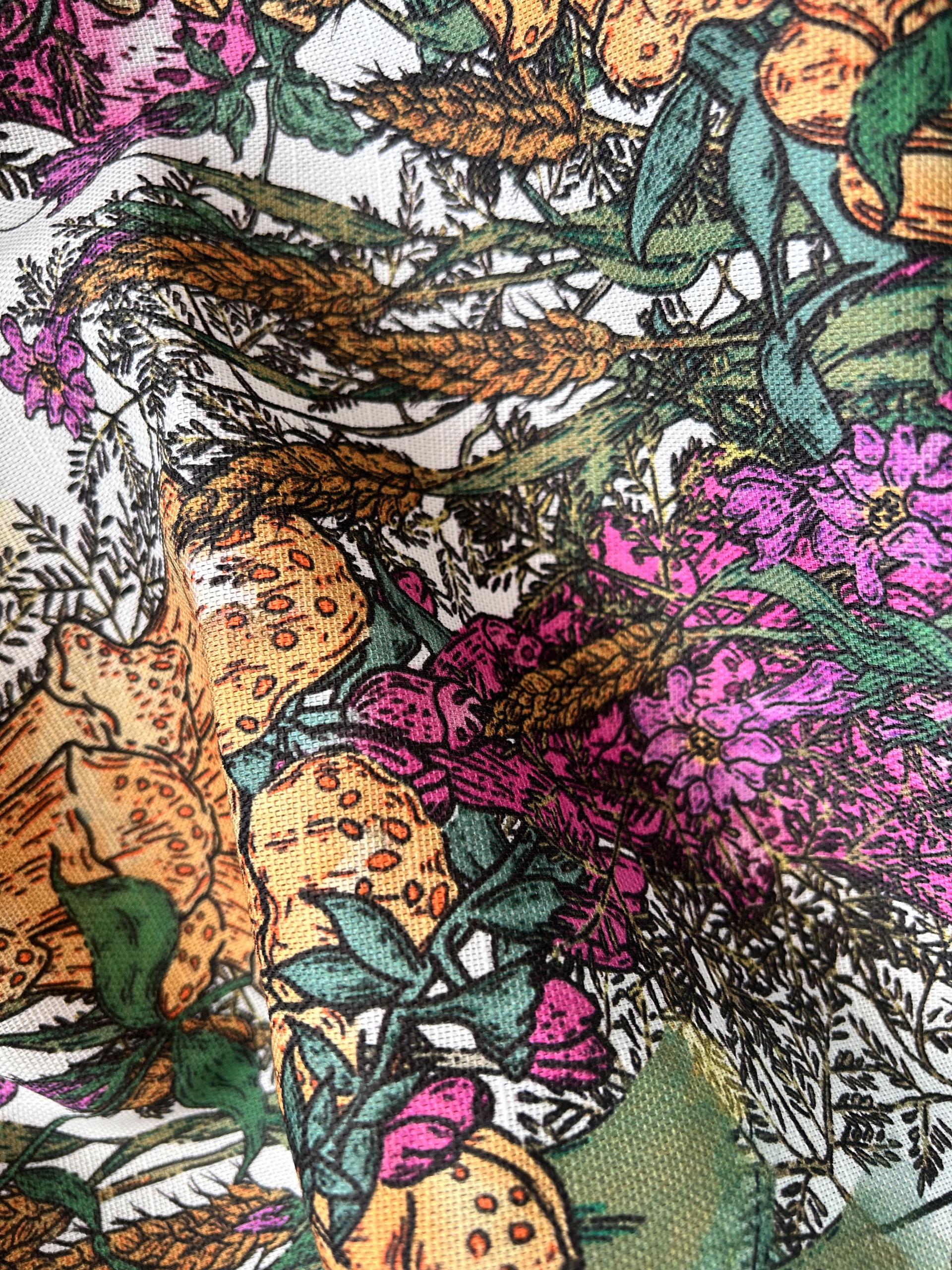 Vibrant patterned fabric showcasing floral and botanical designs, highlighting innovative surface materials at the Surface Design Show.