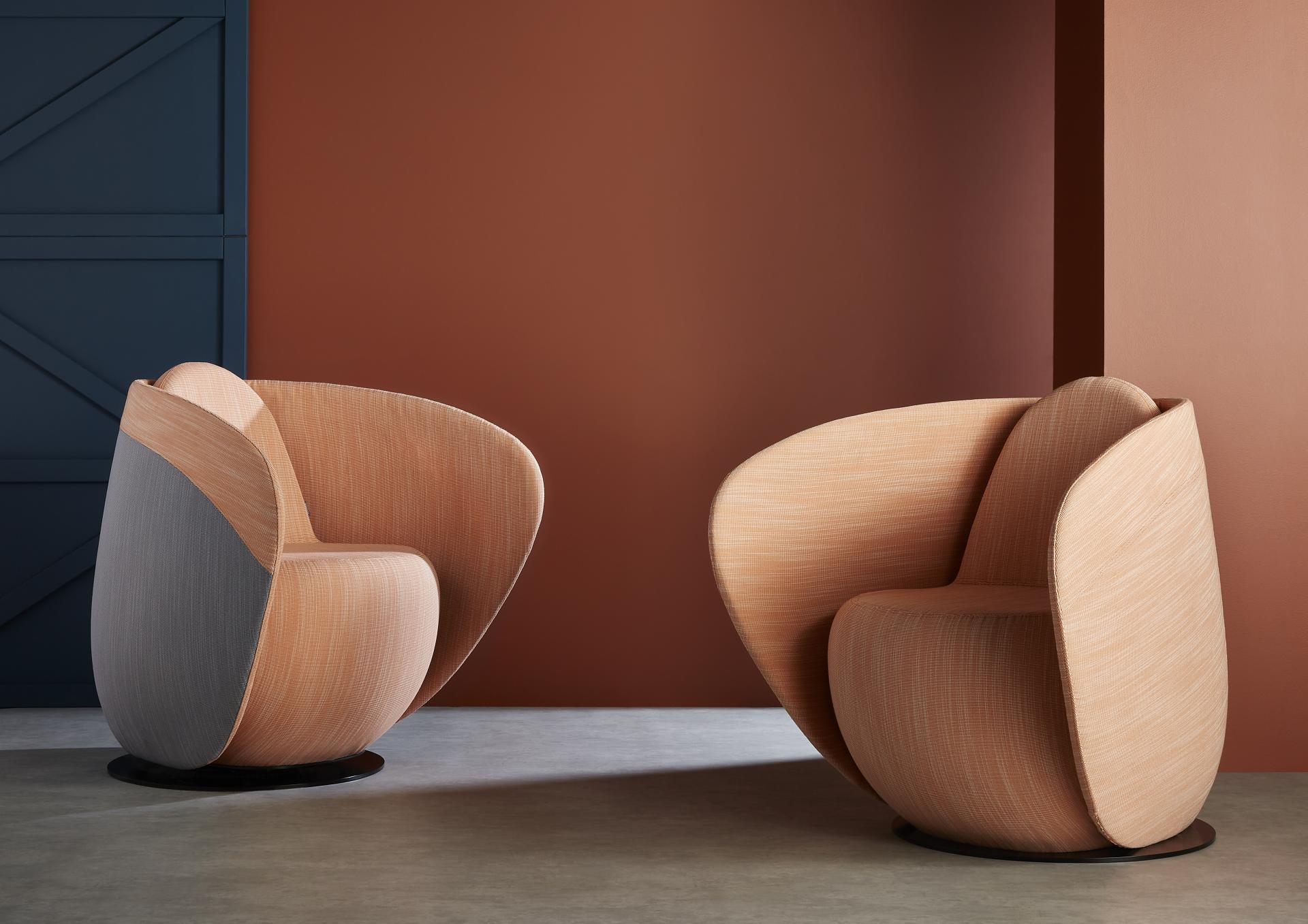 Curved cocoon chairs from Gresham's Relo collection, inspired by sea-smoothed stones, enhancing calming workspaces.