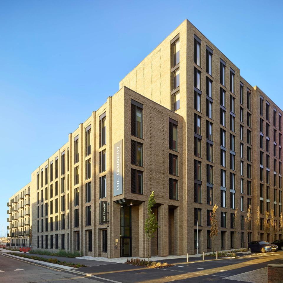 Modern student accommodation building, The Tannery in Leicester, showcasing contemporary architecture and landscaped surroundings.