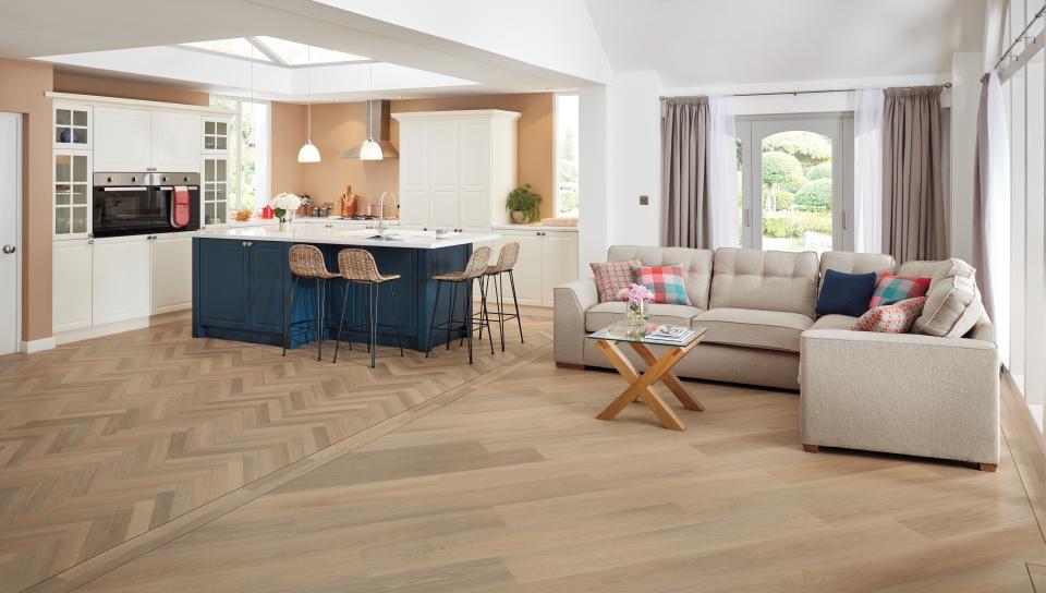 Stylish interior featuring Karndean Designflooring's Art Select wood collection, showcasing a modern kitchen and living area.
