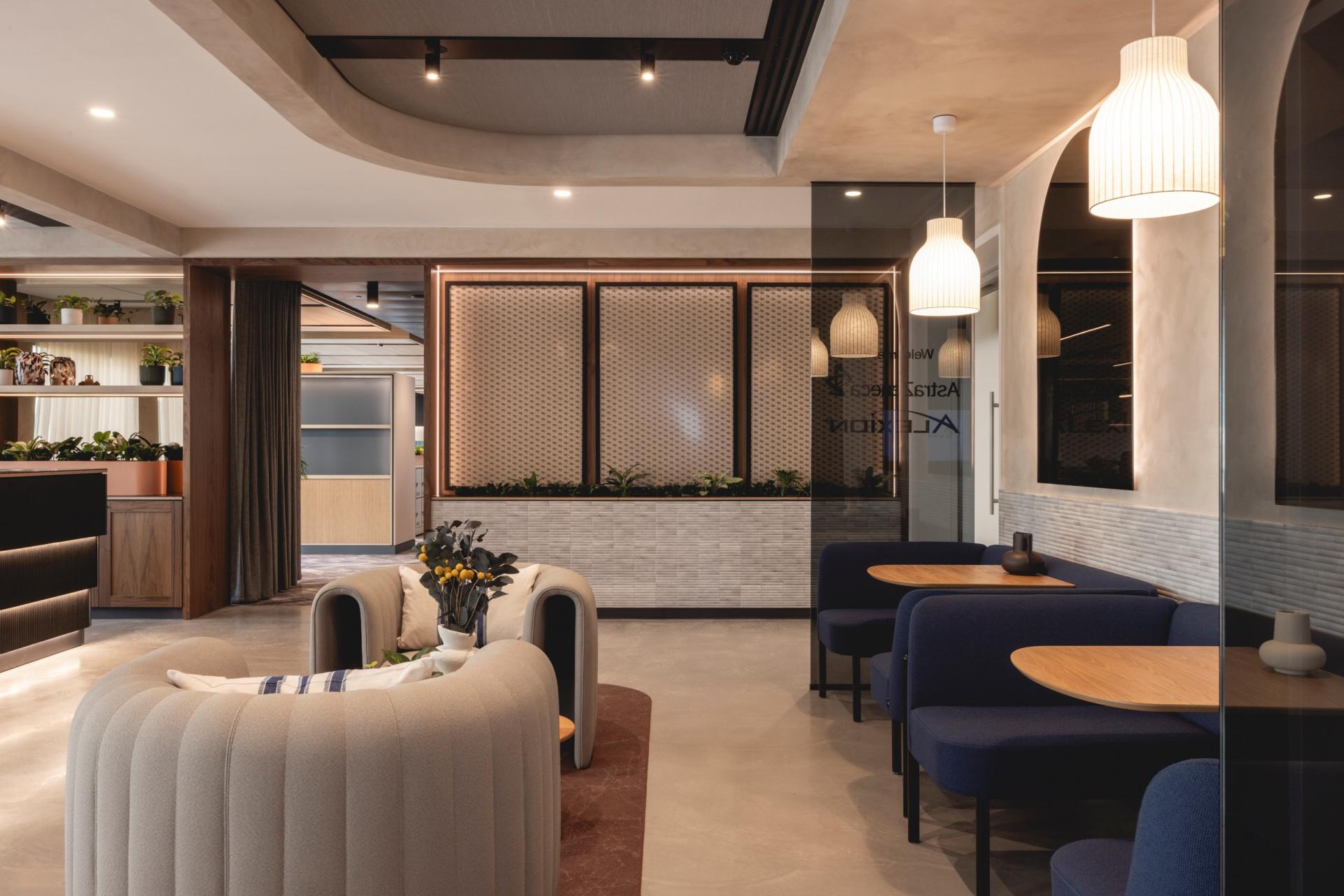 Elegant workspace interior featuring Art Deco-inspired curves, soft lighting, and modern furnishings for a calming ambiance.