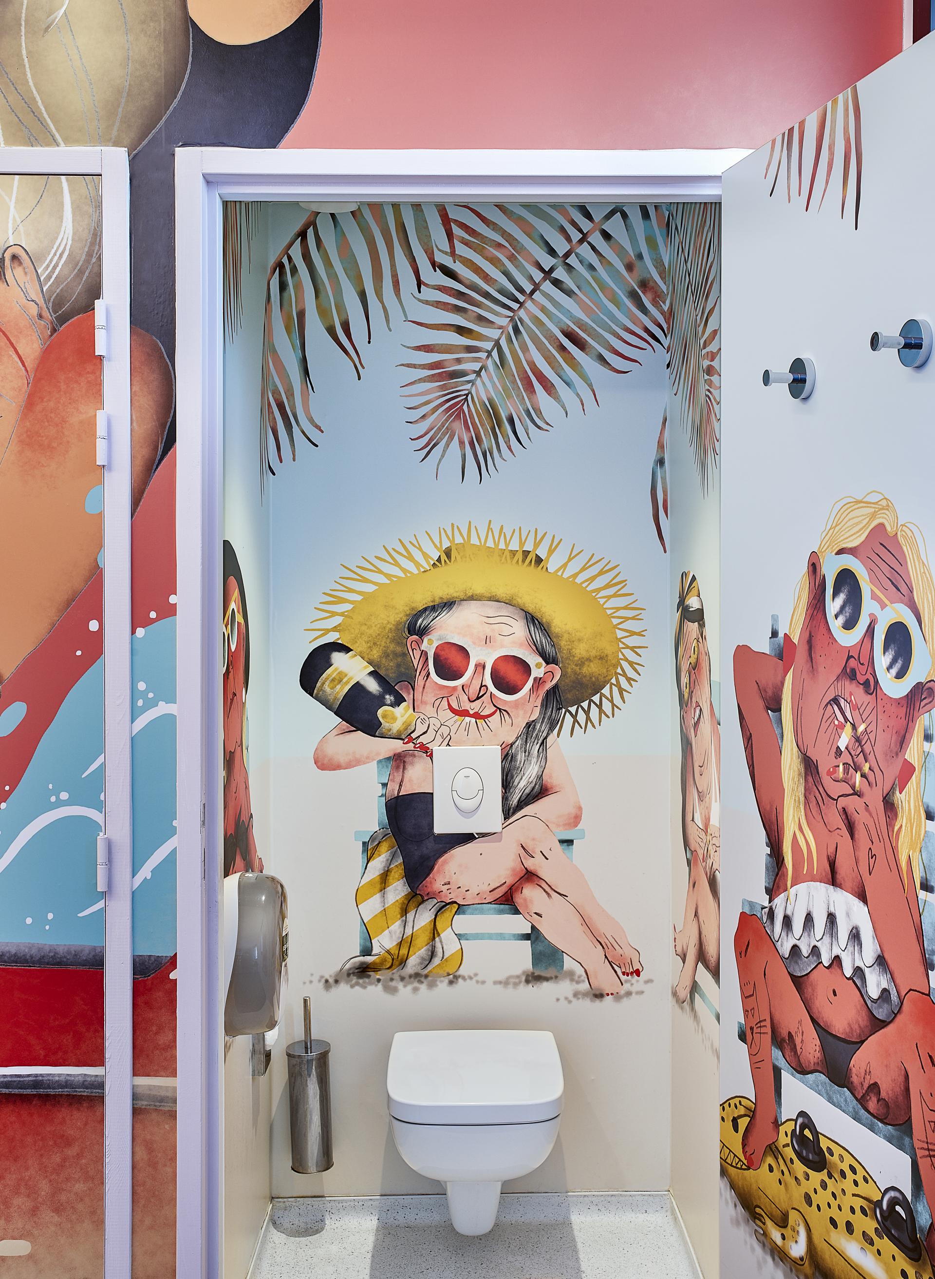 Vibrant restroom mural featuring whimsical beach-themed characters at JO&JOE Paris Gentilly, awarded Best Hotel & Tourism Resort.
