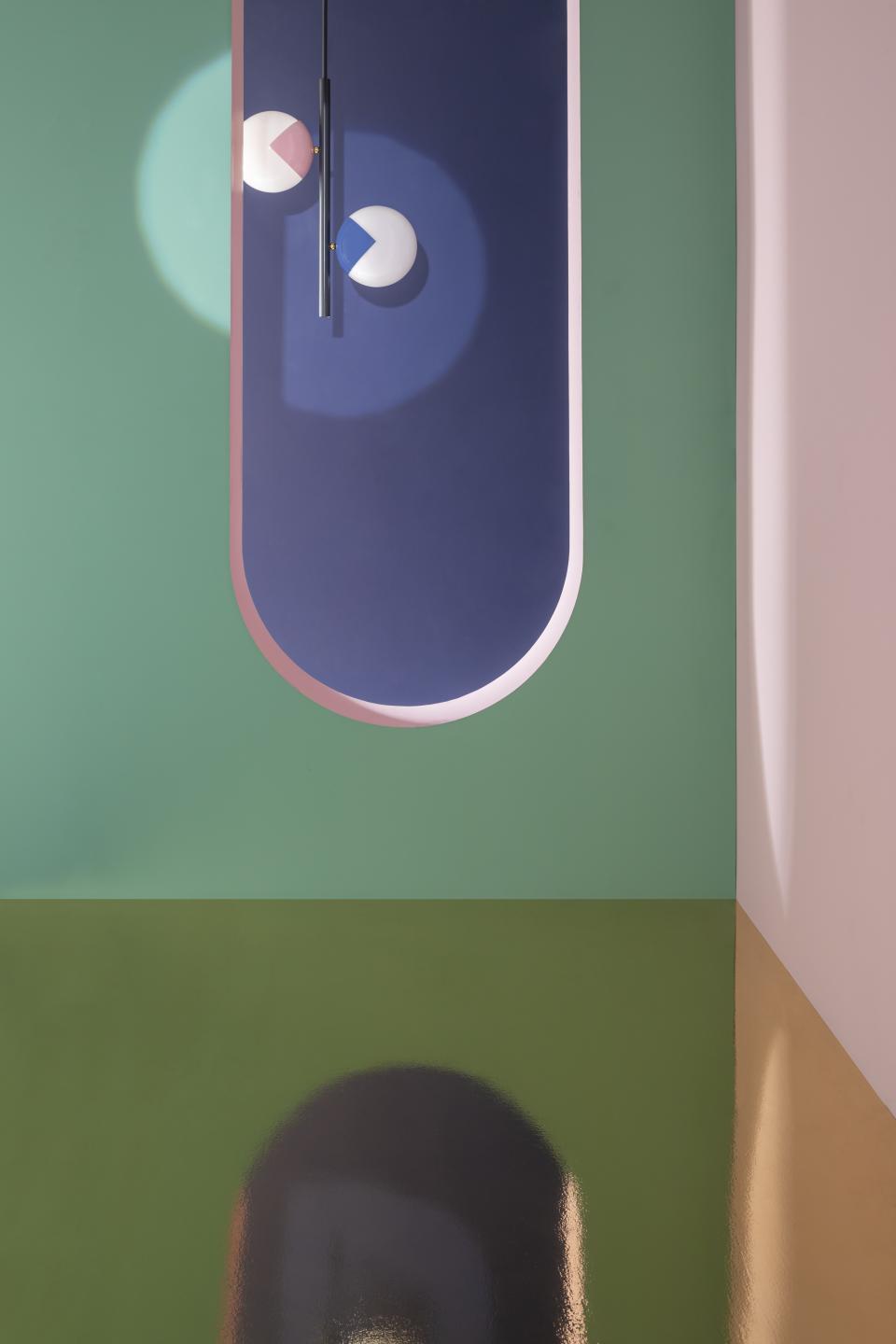 Colorful 'eyeball' lamps designed by Magic Circus, showcased against a vibrant backdrop in a modern interior setting.