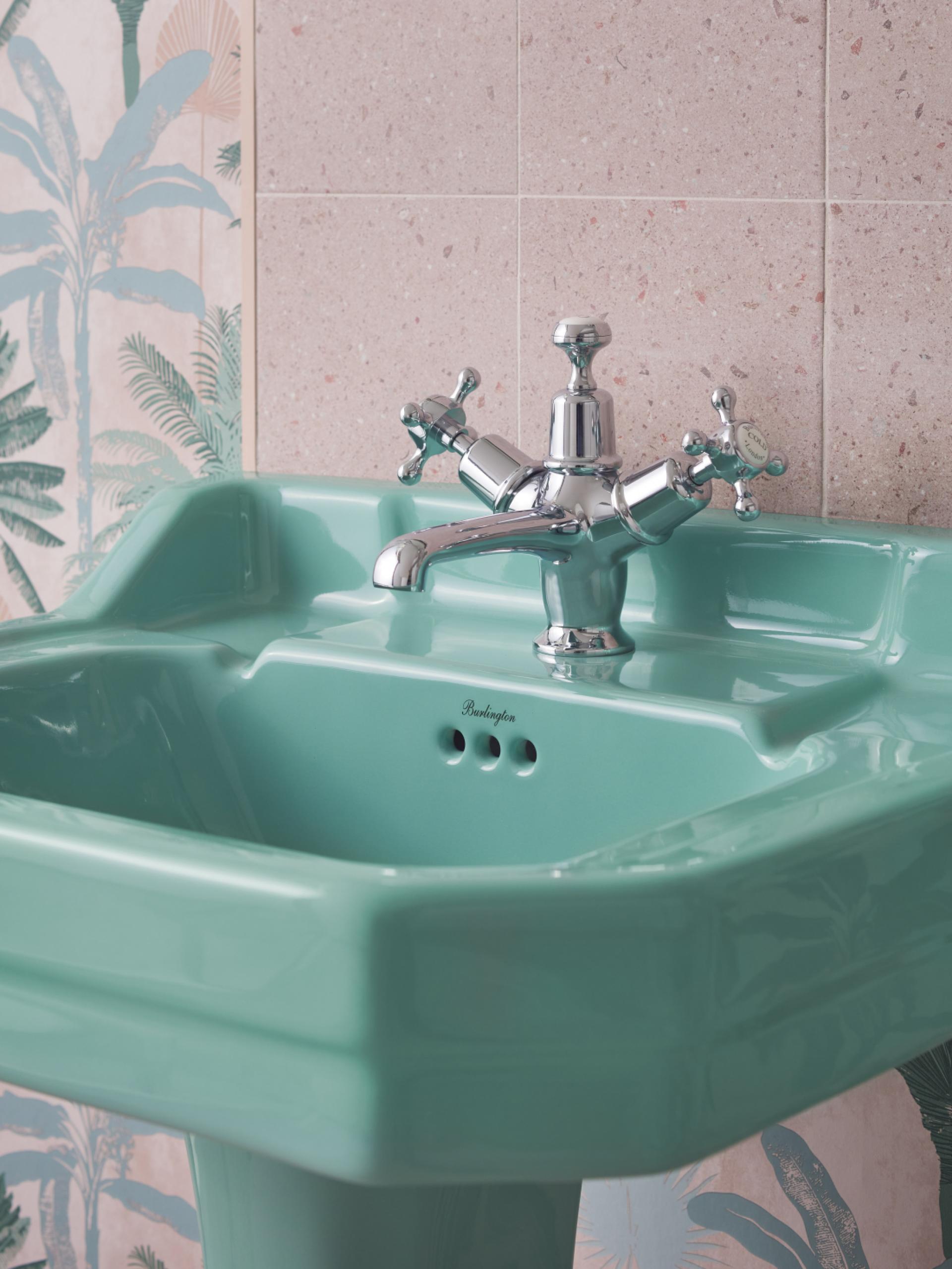 Stylish green vintage sink with a chrome faucet, showcasing a modern design element for Material Source Studio Glasgow.