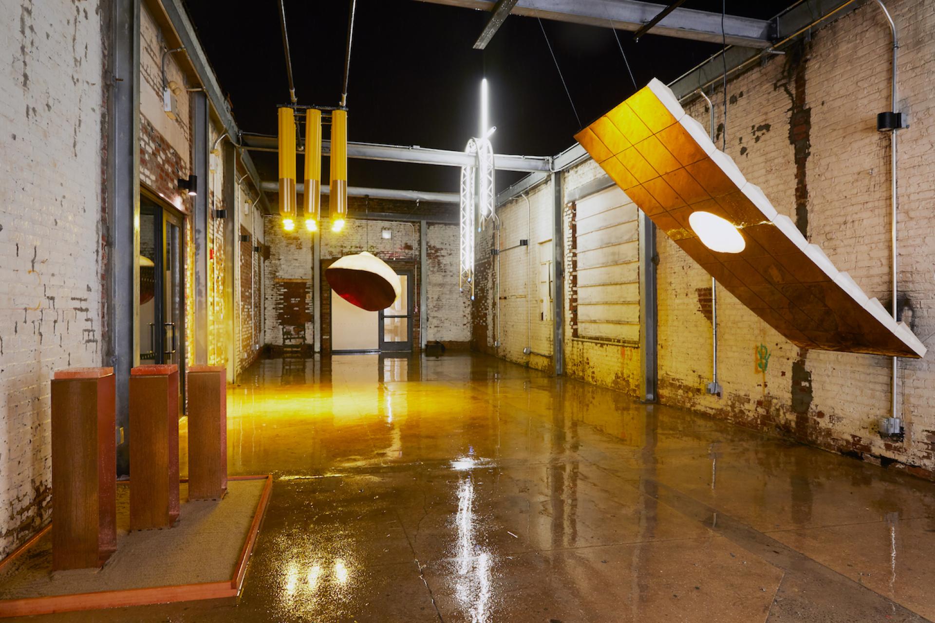 Urban art exhibition featuring innovative installations celebrating MINI's launch of its electric model in a vibrant warehouse space.