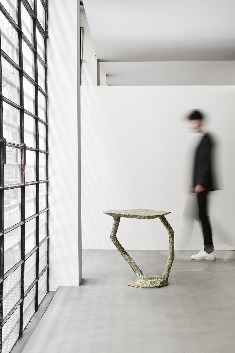 Sculptural furniture piece by Vincenzo de Cotiis showcased in a minimalist gallery space, highlighting opulent materials.
