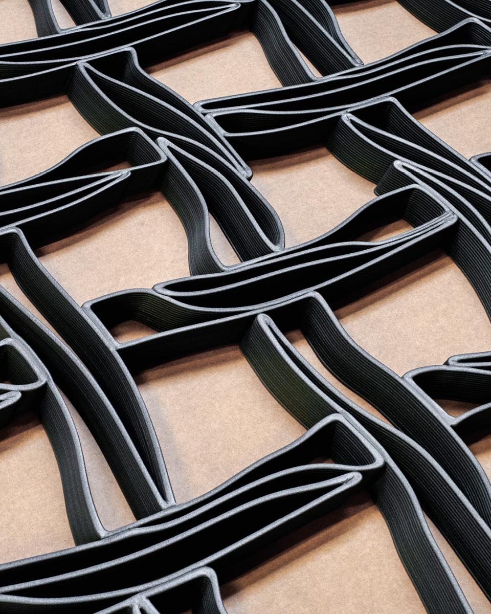 3D printed interlocking façade made from recycled materials, showcasing BOSS store's innovative design at İstinye Park, Istanbul.