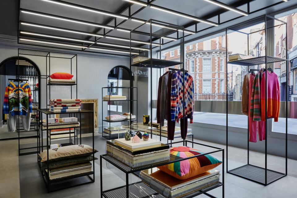 Luxurious interior of Browns store featuring vibrant clothing displays and modern lighting design by Nulty.