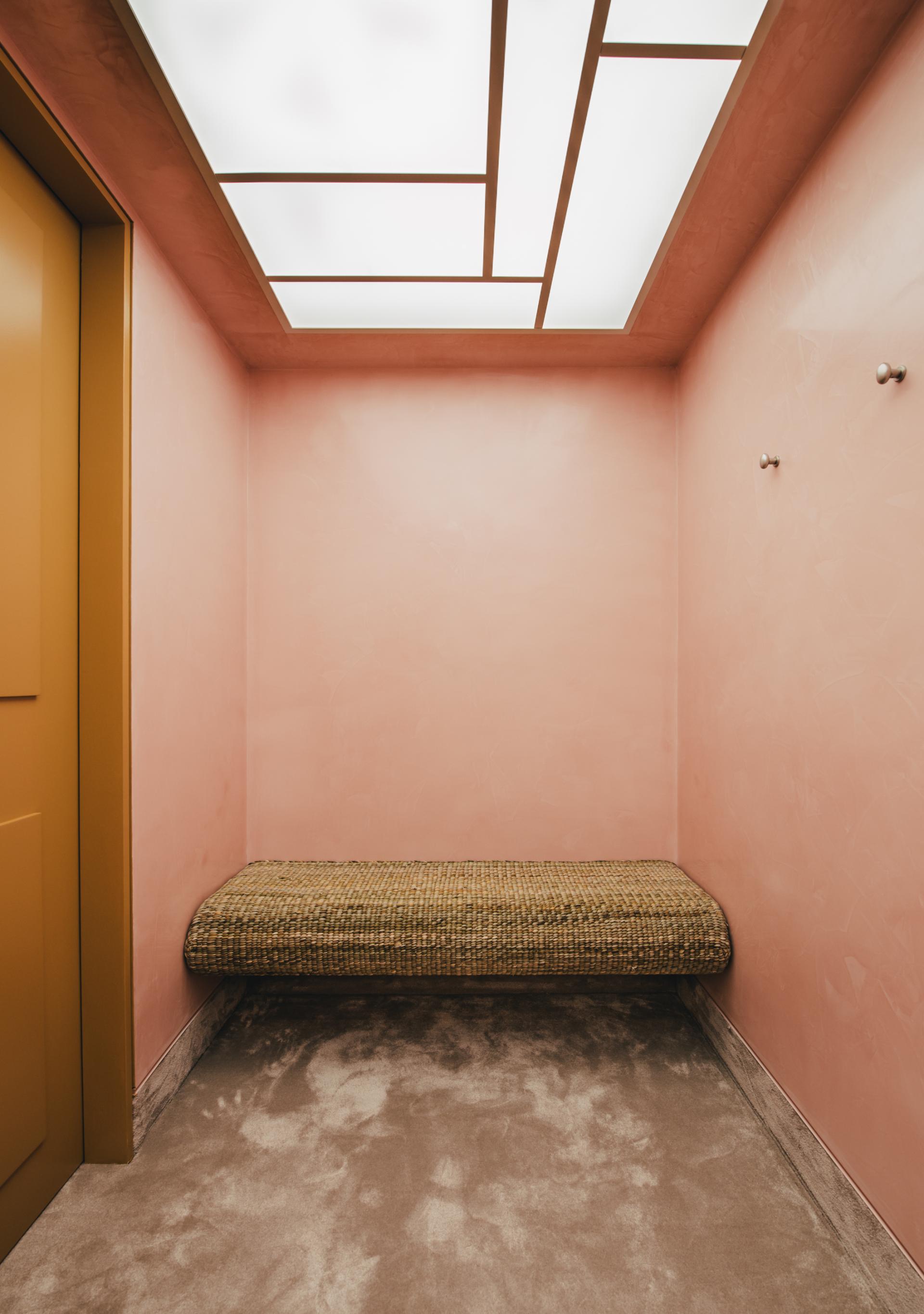 Trendy pink interior featuring a textured bench and modern ceiling design, highlighting innovative craftsmanship from London Craft Week 2024.