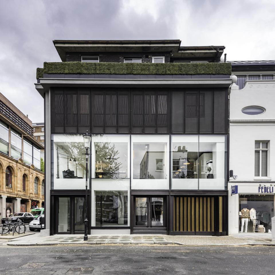 Brompton Cross showcases De Padova's first UK flagship store featuring modern Italian design and an elegant glass facade.
