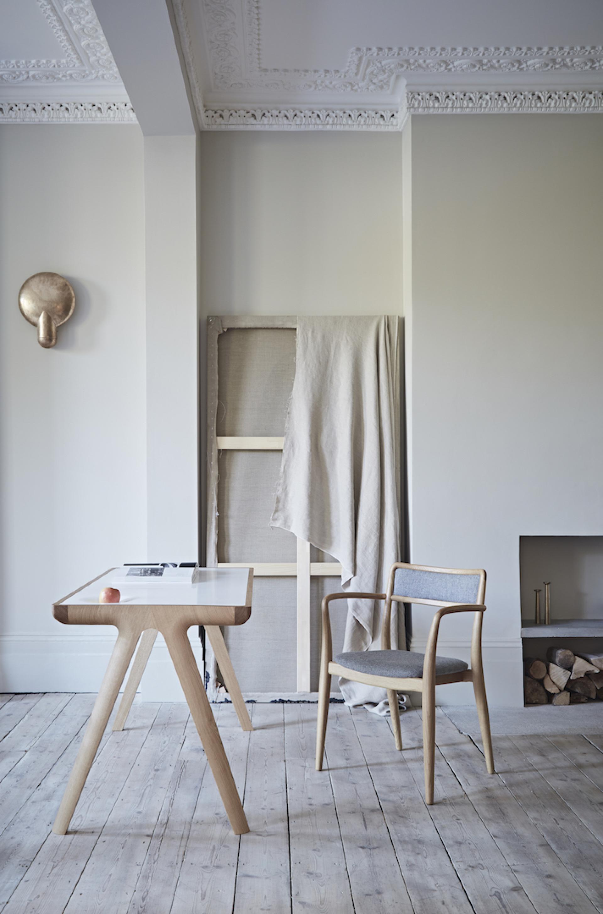 Stylish wooden table and chair set in a minimalist room highlighting Dare Studio’s craftsmanship and modern design.