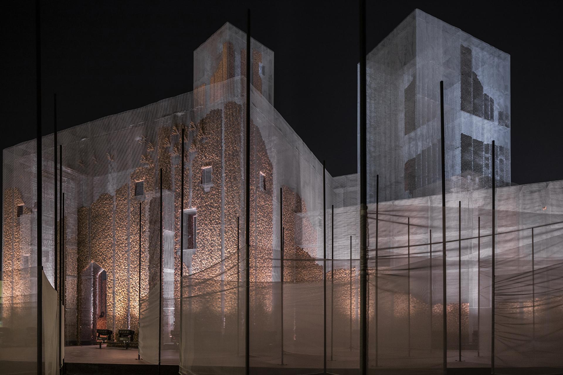 Gharfa installation by Studio Studio Studio showcases ethereal architecture with illuminated textures against a night backdrop in Riyadh.
