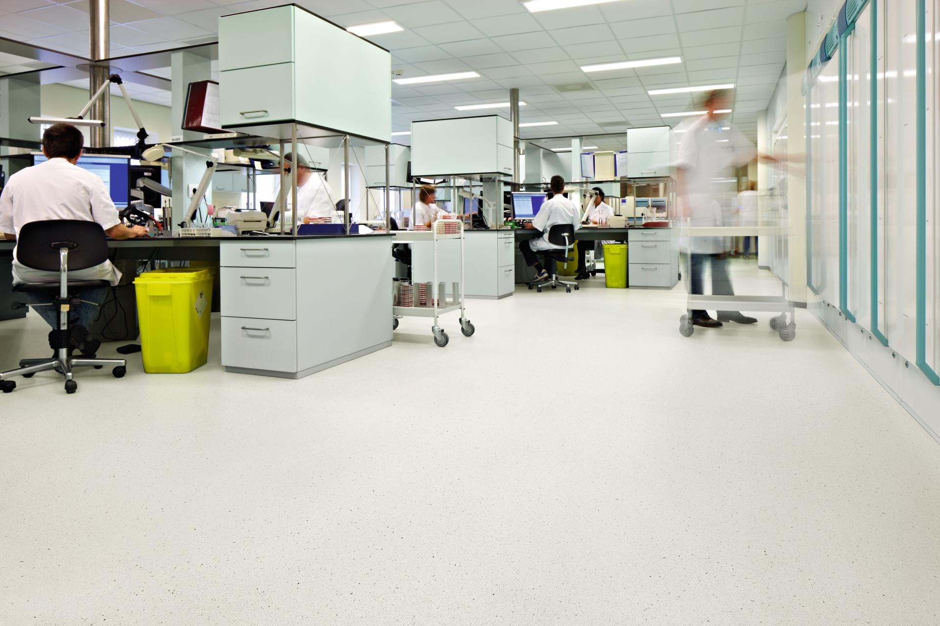Modern laboratory workspace featuring Forbo's new adhesive-free safety flooring, designed for quick installation and durability.