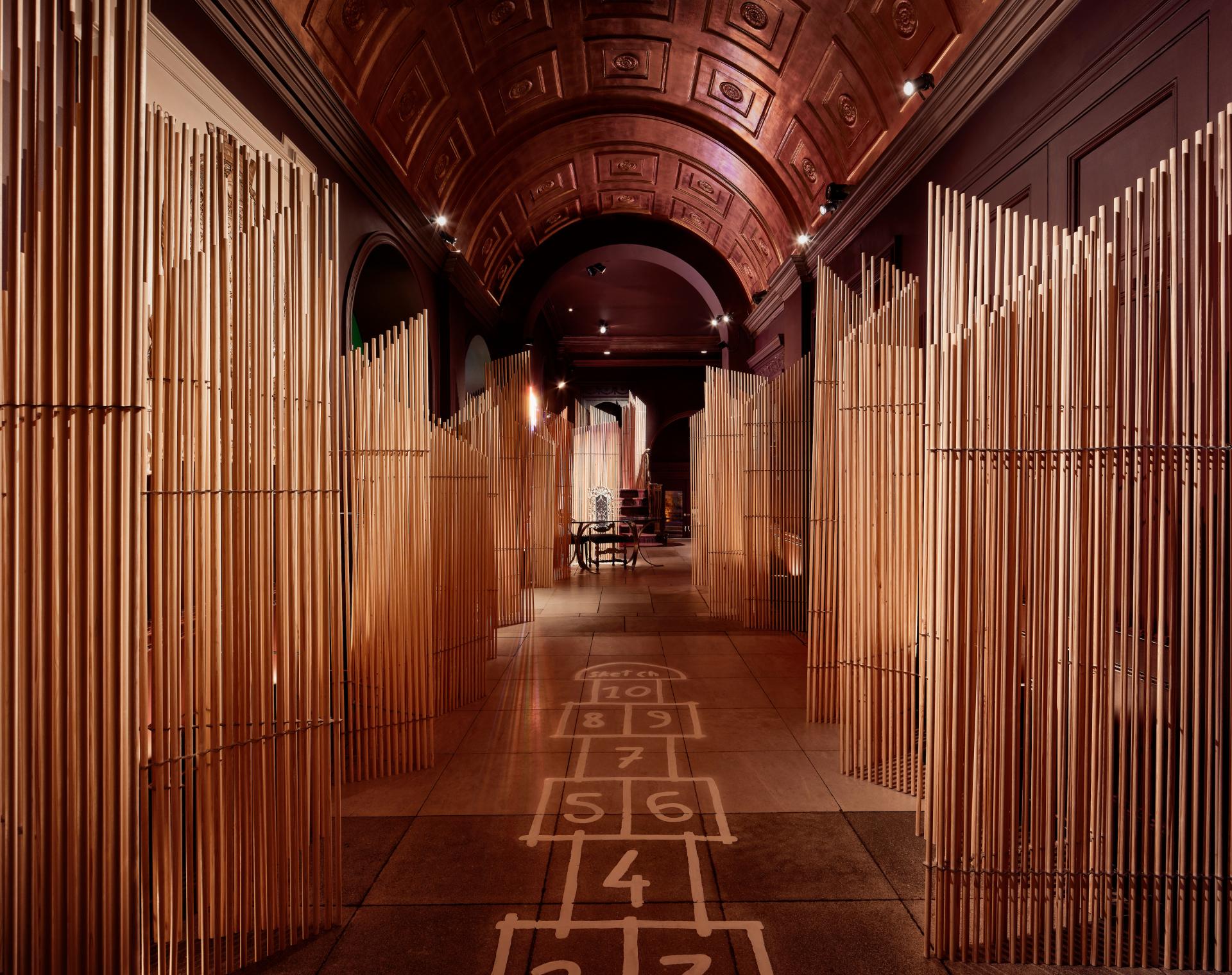 Wooden dividers create an artistic path featuring a hopscotch design in Matter of Stuff's A Second Life exhibition.