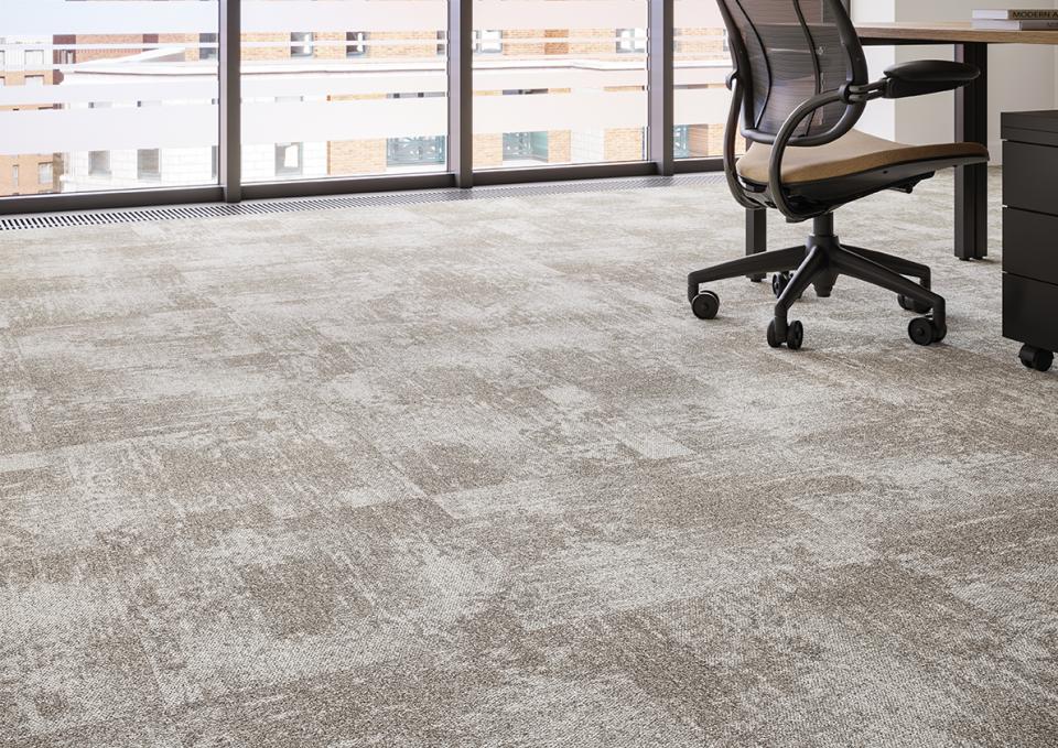 Modern workspace featuring Tessera Infused carpet tiles, designed for style and functionality in office interiors.