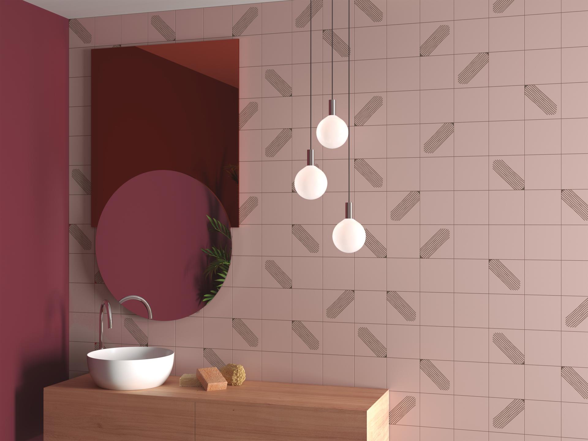 Maximalist bathroom design featuring pink patterned tiles, modern round mirror, and stylish pendant lights.