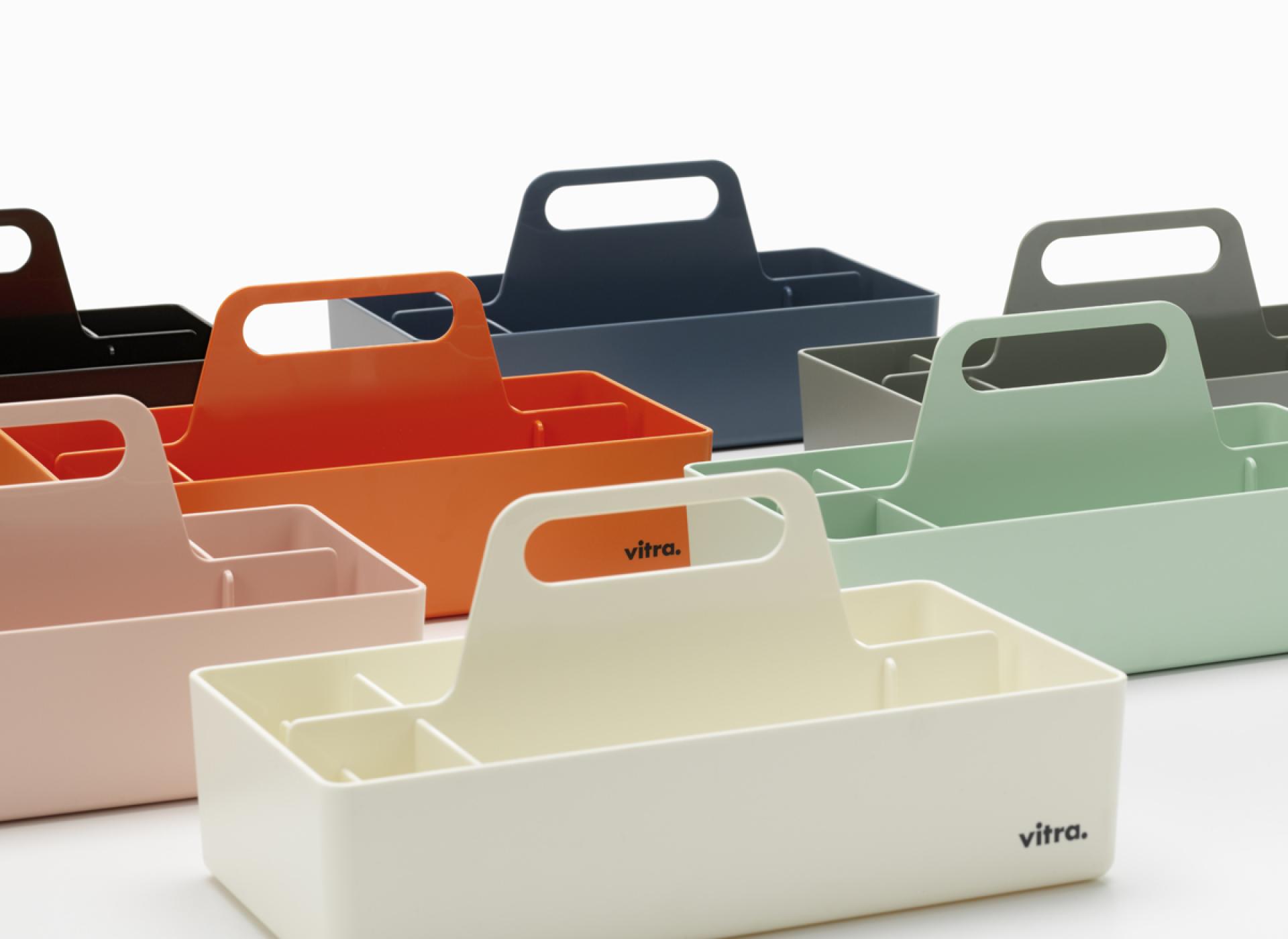 Colorful Vitra storage trays in various sizes and shades, showcasing modern design for the accessories collection.