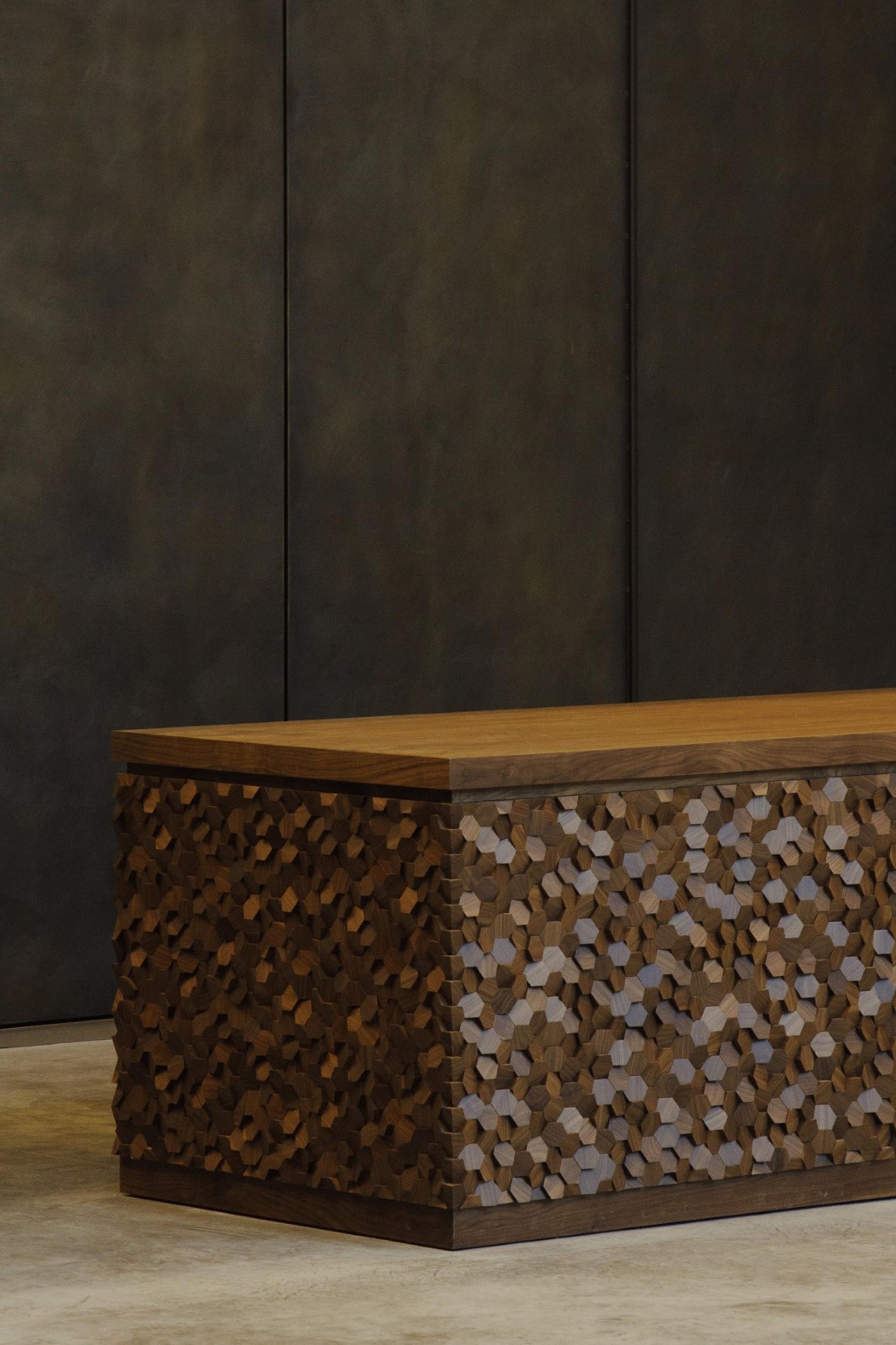 Artistic wooden furniture featuring intricate, geometric patterns, reflecting innovative materiality and design by Giles Miller Studio.