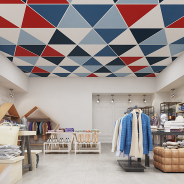 Colorful Aruba Triangle ceiling tiles by Zentia in a trendy boutique setting filled with clothing displays.
