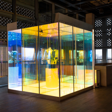 Interactive Lutron display featuring vibrant lighting and floral arrangement, showcasing innovative design inspiration for architecture and lighting.