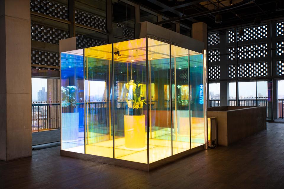 Interactive Lutron display featuring vibrant lighting and floral arrangement, showcasing innovative design inspiration for architecture and lighting.