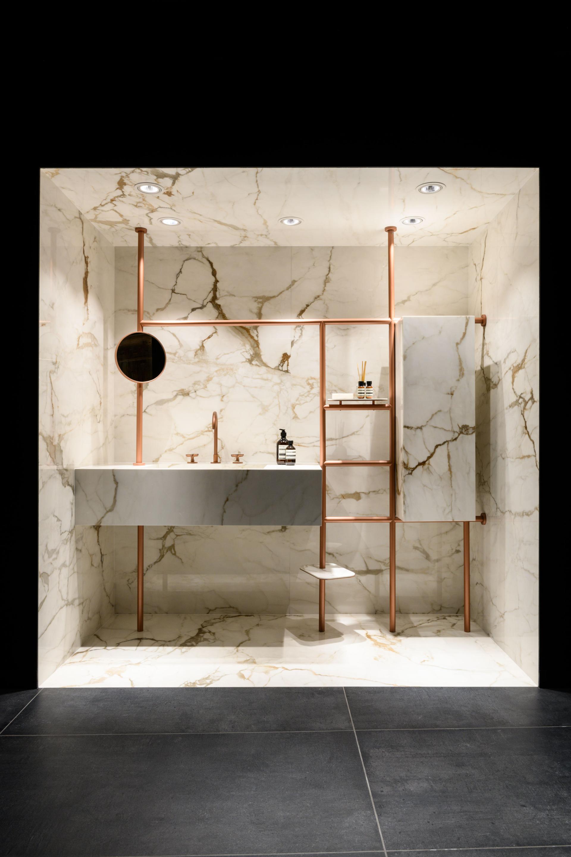 Luxurious bathroom display featuring marble tiles and modern design elements at Iris Ceramica Group's UK showroom in Clerkenwell.