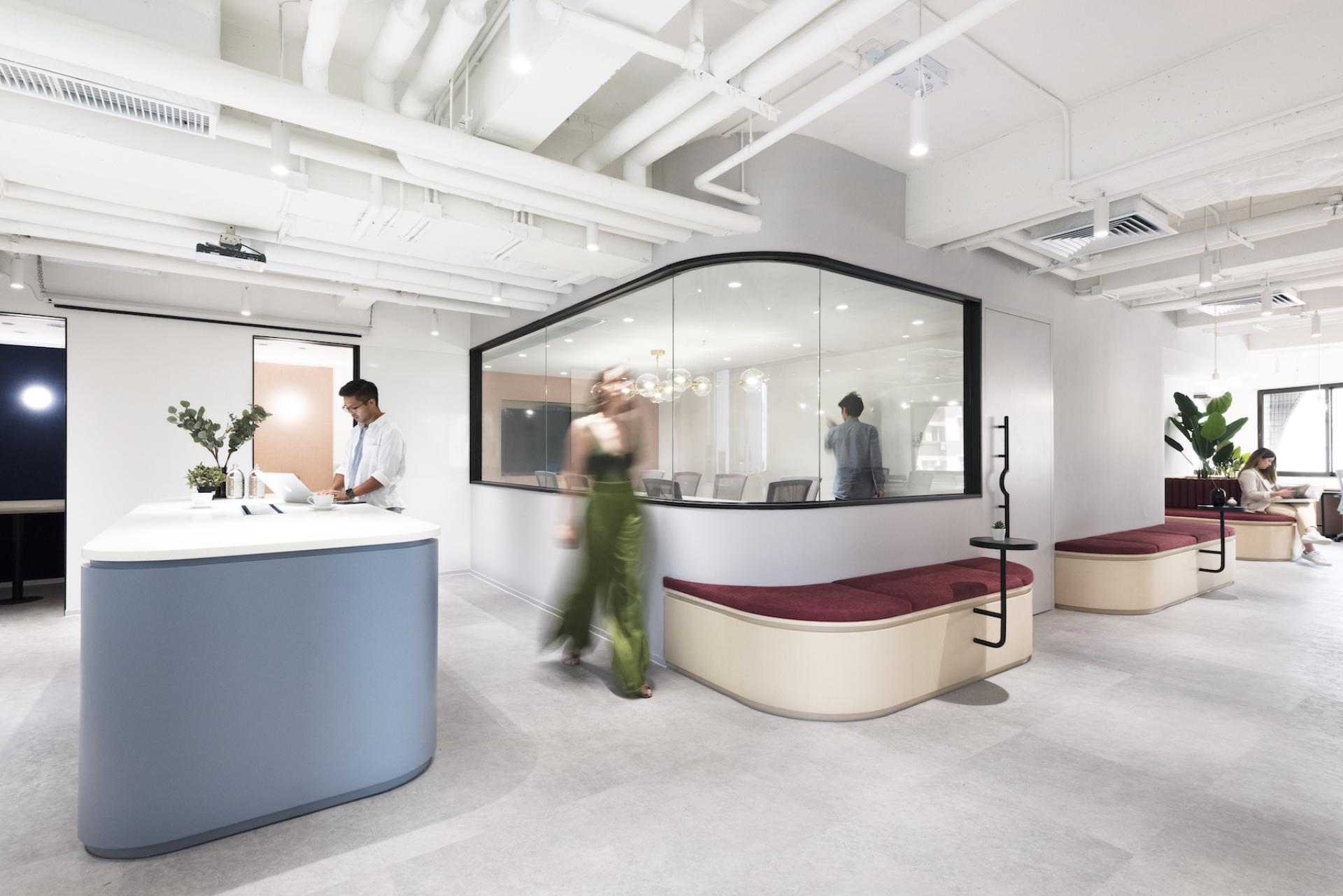 Modern office design featuring collaborative workspaces and comfortable seating, showcasing Charterhouse's new workspace by Bean Buro.