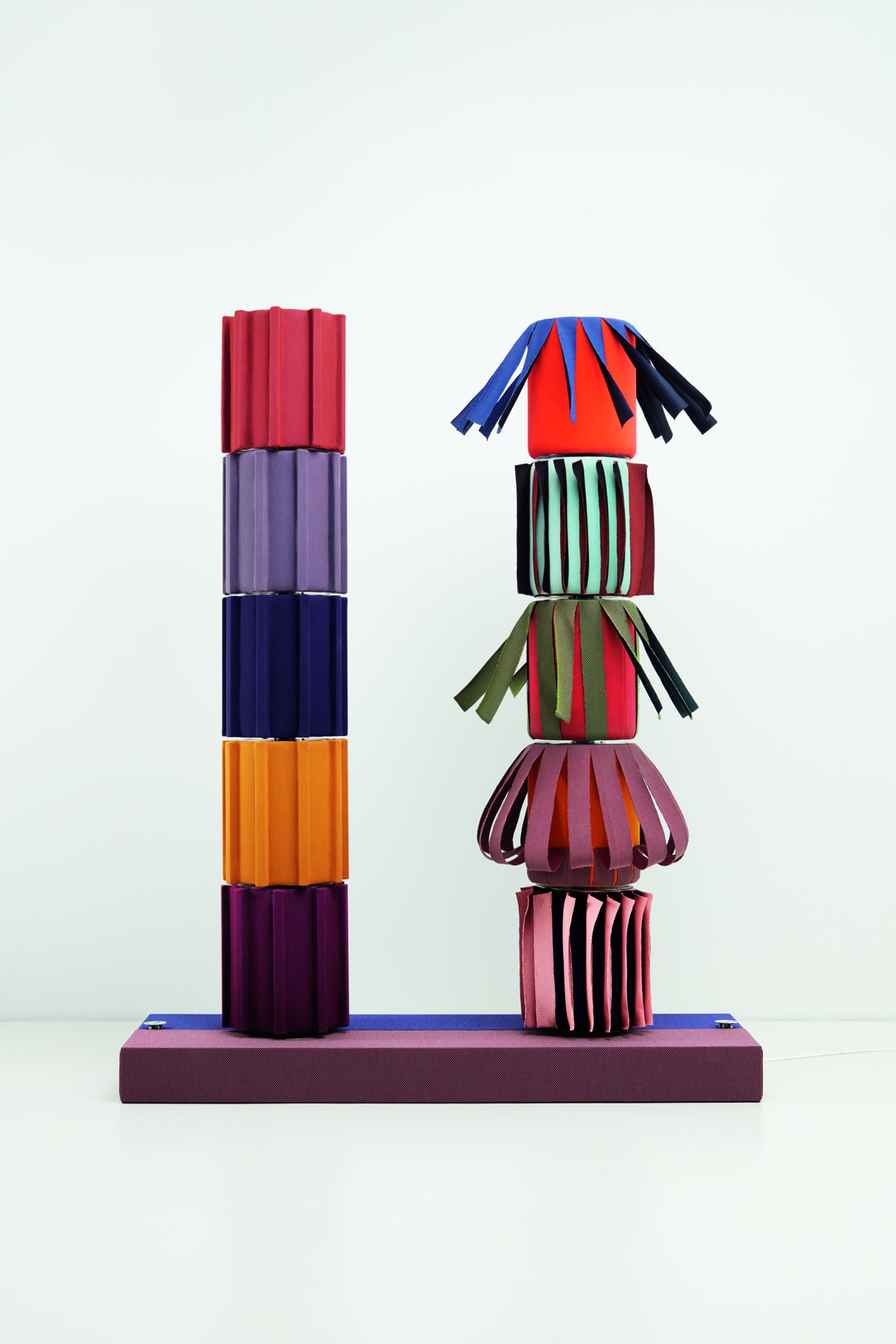 Colorful textile sculptures created by different designers, showcasing innovative uses of knitted materials in the Knit! by Kvadrat series.