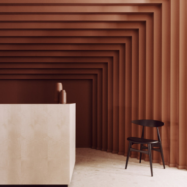 Contemporary workspace design featuring a textured brown wall, minimalist reception desk, and stylish black chair at Summit House.