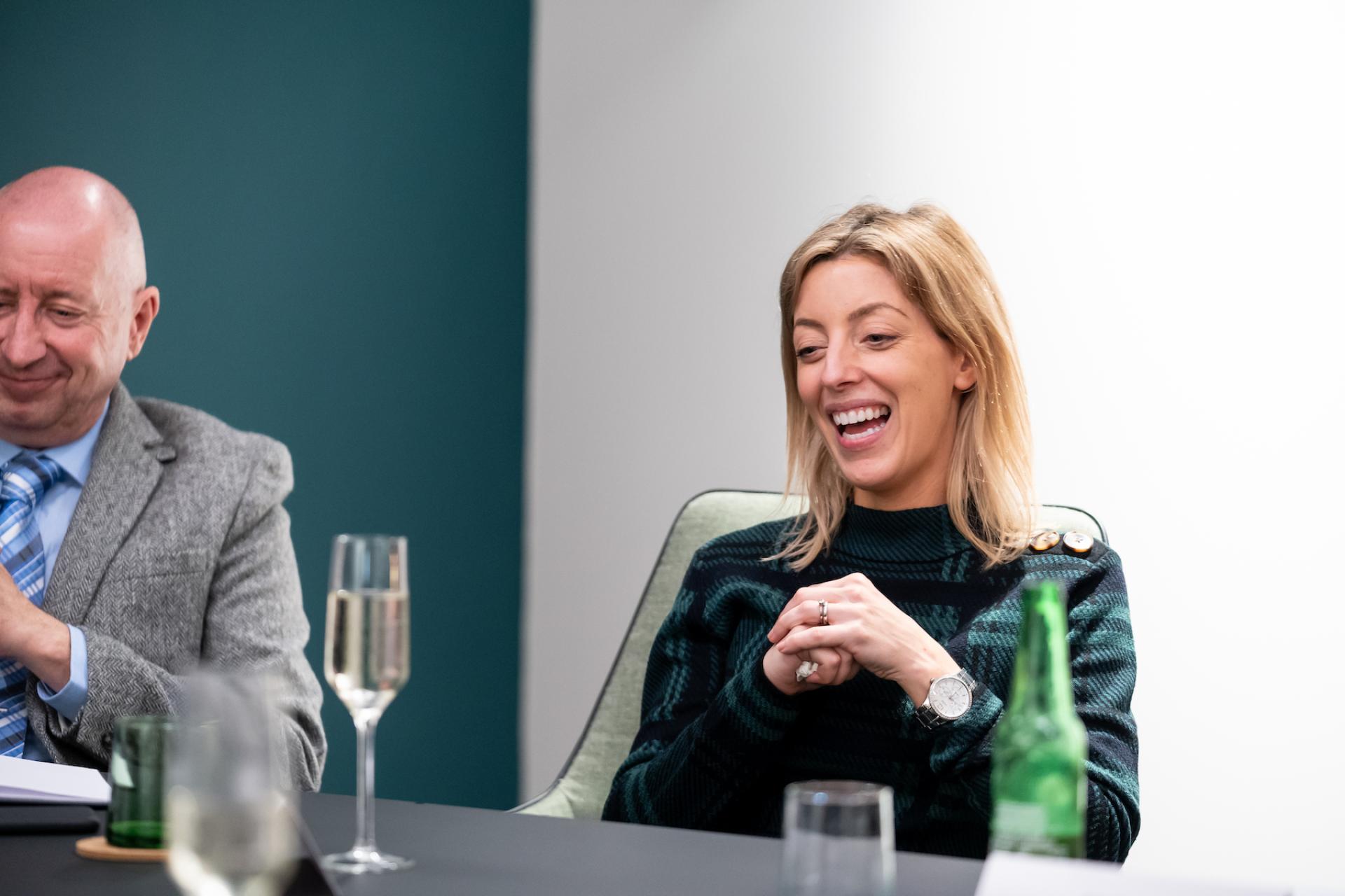 Participants engage in a discussion about the future of education, highlighting collaboration and innovative ideas during a meeting.