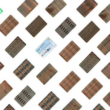 Colorful cassette tapes and cards arranged in a pattern, highlighting Rehyphen®'s up-cycling initiative for discarded music materials.